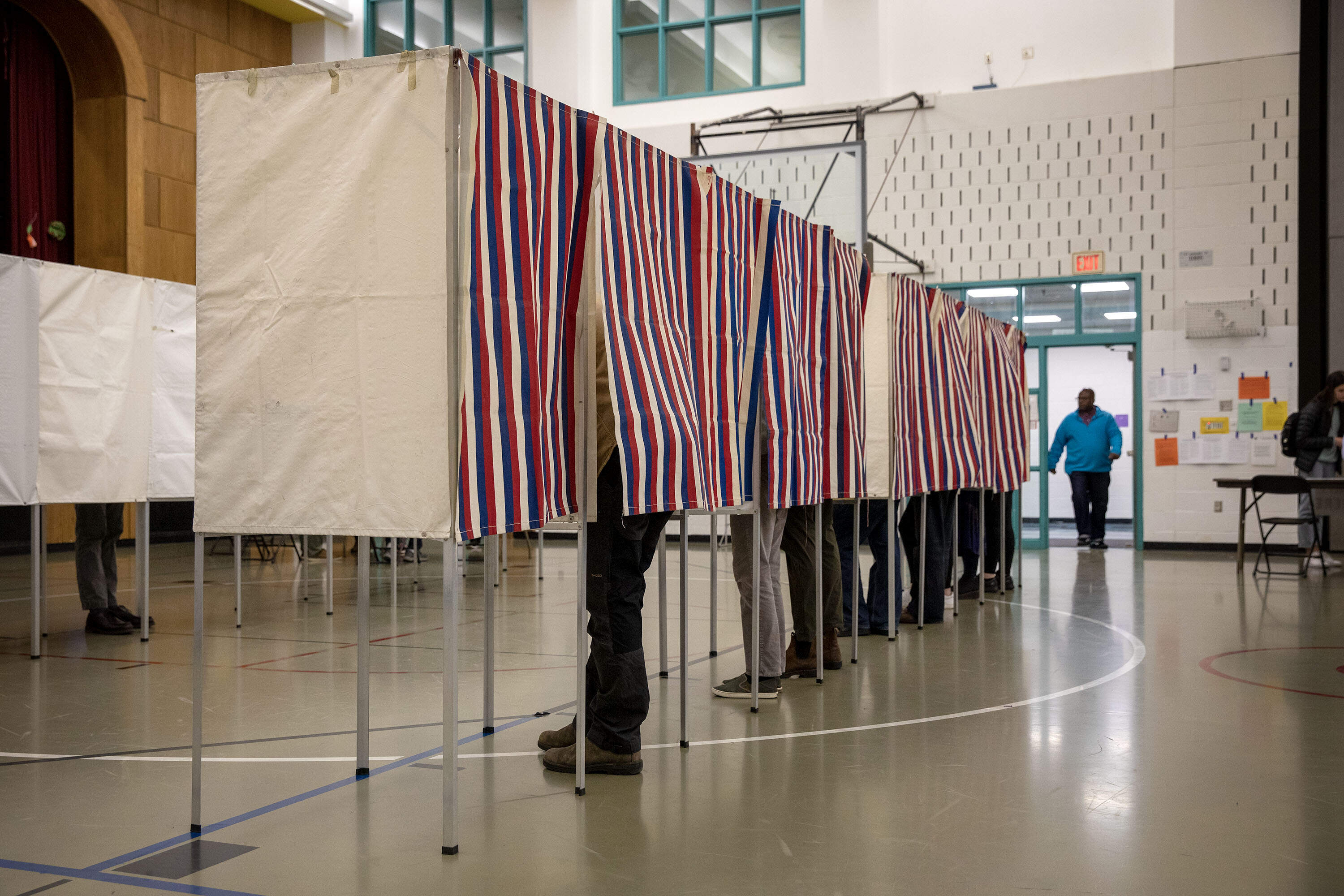 Cambridge voters fill the voting booths at the Baldwin School. (Robin Lubbock/WBUR file photo)