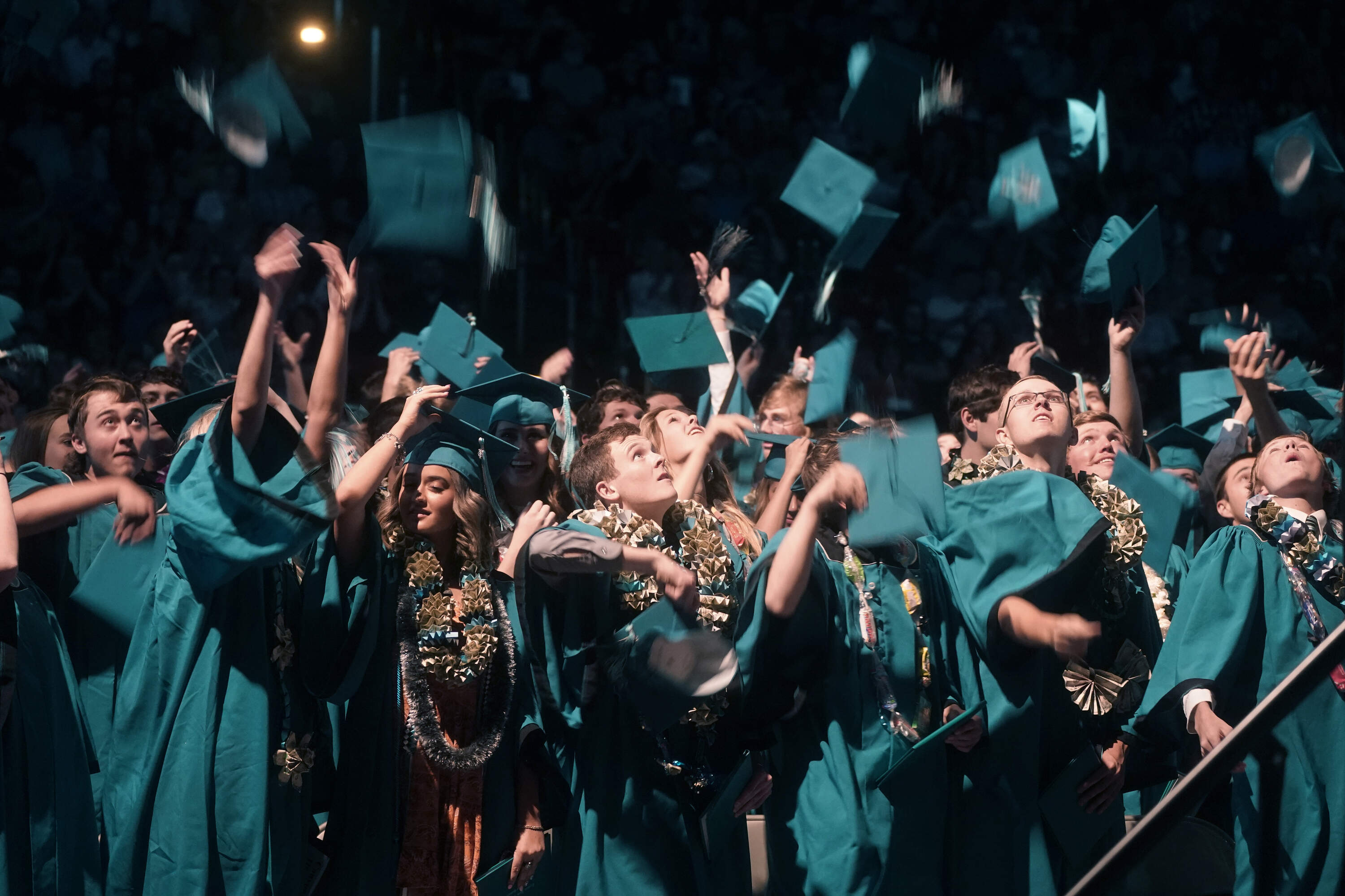 Graduates celebrate as they throw their caps in the air after the Canyon View High School graduation Wednesday, May 25, 2022, in Cedar City, Utah. (Rick Bowmer/AP)