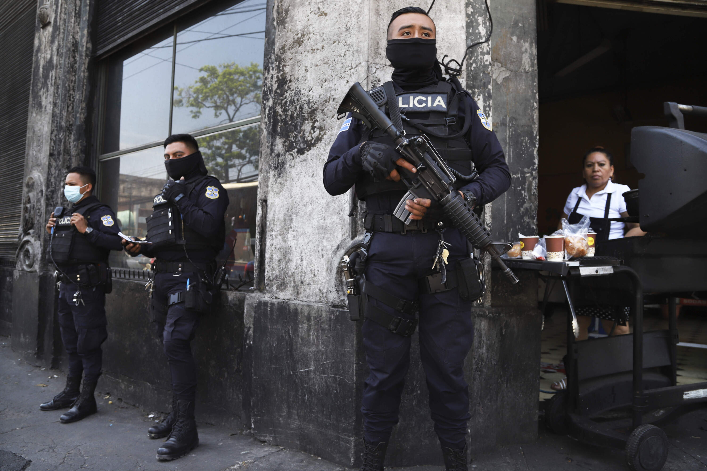 Heavily armed police guard the streets on March 27, 2022, after El Salvador's congress granted President Nayib Bukele's request to declare a state of emergency, amid a wave of gang-related killings. (Salvador Melendez/AP File)