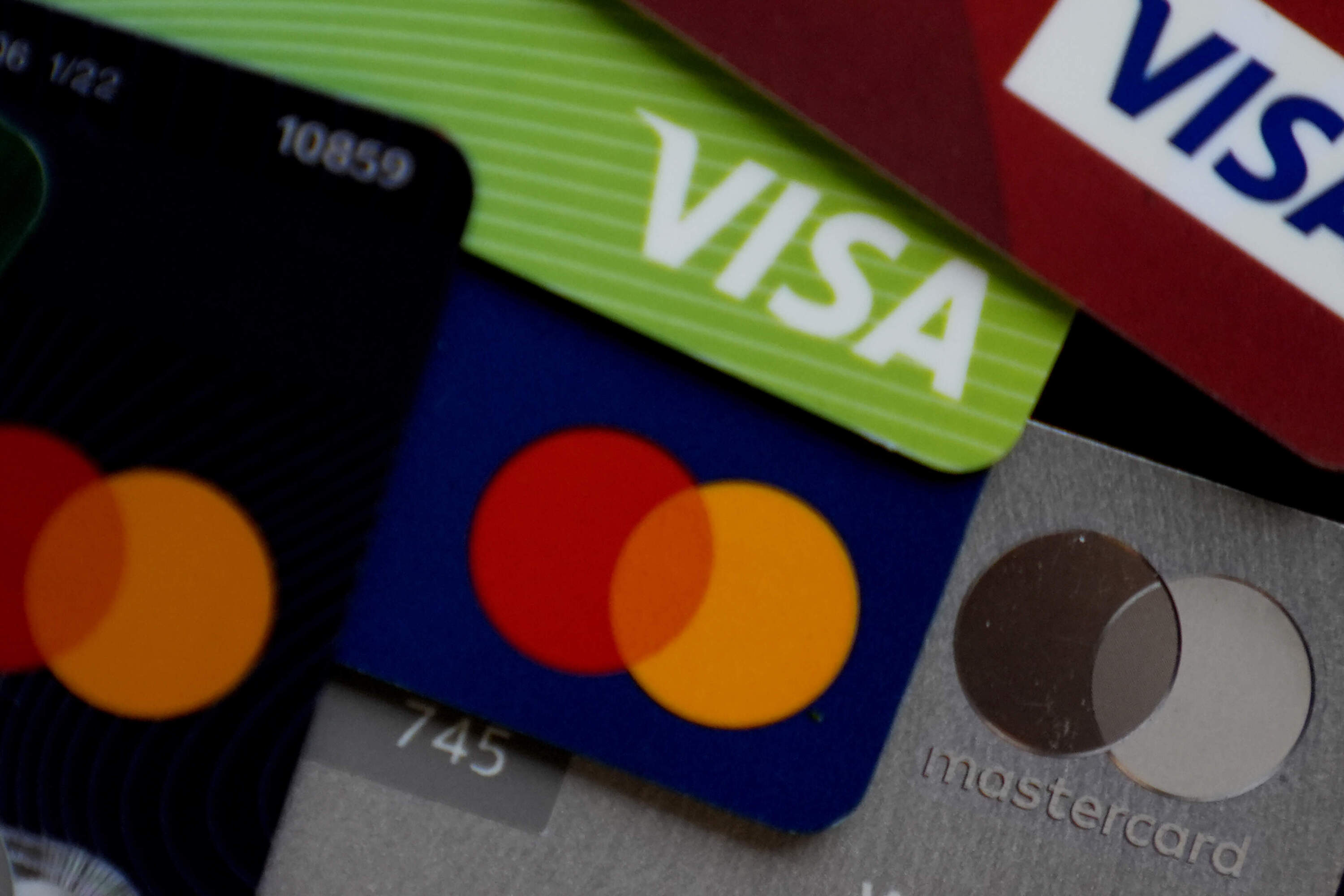 Several VISA and Mastercard credit cards are shown. (Nam Y. Huh/AP)