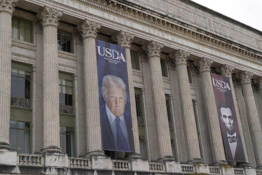 Banners with the photographs of PresidentTrump and President A Lincoln hang near the entrance of the U.S. Department of Agriculture building in Washington, D.C. on Friday, May 16. (Jose Luis Magana/AP)