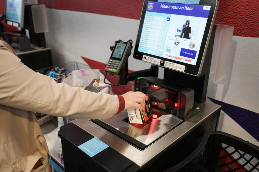 A customer uses a self checkout terminal at the new Tarleton Aldi store on July 22, 2022 in Tarleton, United Kingdom. (Christopher Furlong/Getty Images)