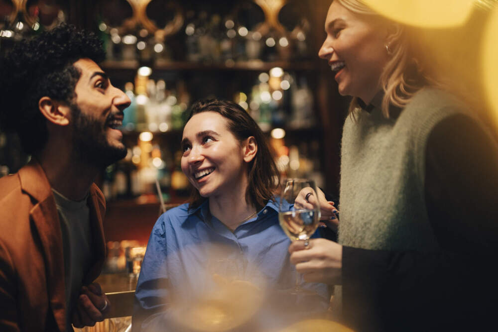 Friends enjoy time together in a bar. (Maskot/Getty Images)