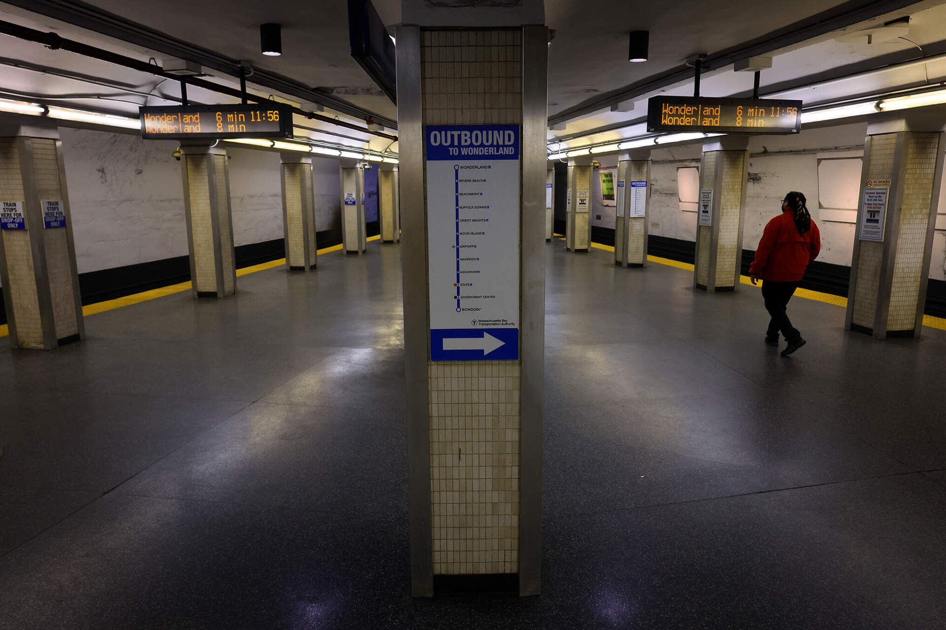 A passenger walks the platform at the MBTA Bowdoin Station on the Blue Line.
