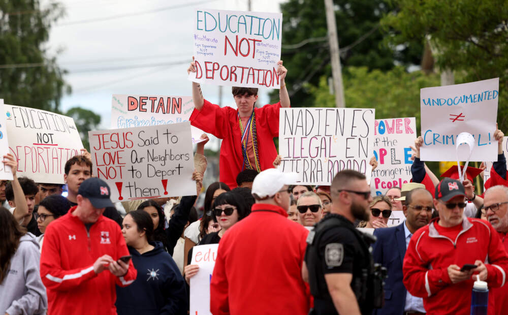 Milford High School graduates protest outside of Milford Town Hall, calling for the release of their peer. (Jessica Rinaldi/The Boston Globe via Getty Images)