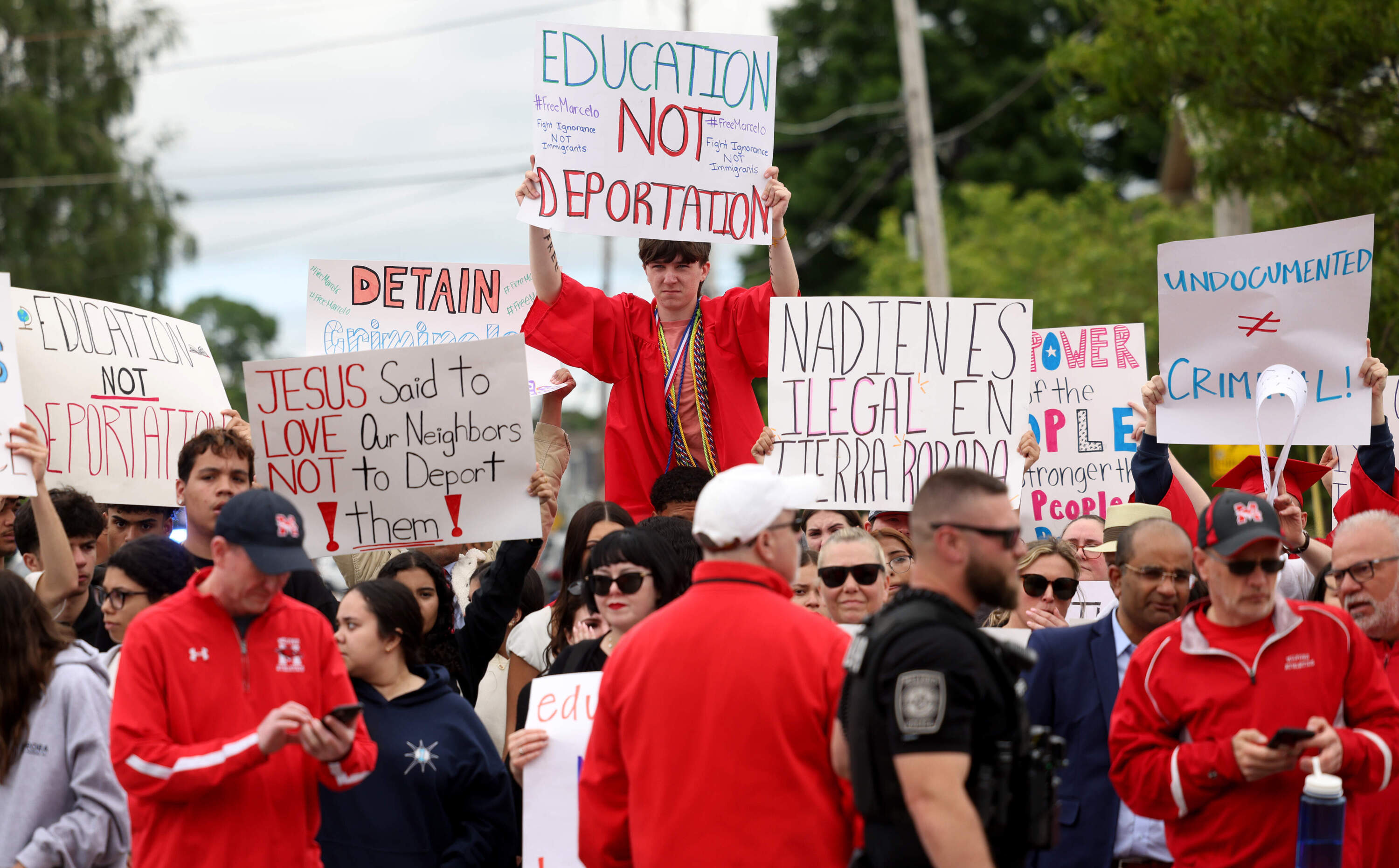 Milford High School graduates protest outside of Milford Town Hall, calling for the release of their peer. (Jessica Rinaldi/The Boston Globe via Getty Images)