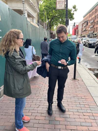 A Crimson Courage volunteer passes out stickers near Harvard's campus. (Courtesy Lisa Paige)