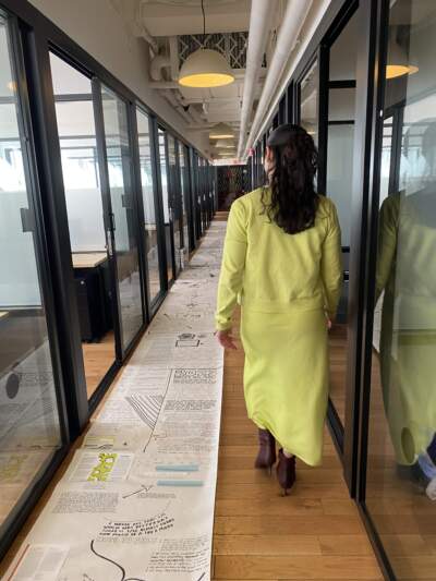 As a college student, Megan Burke started a "dream scroll" for her self-soothing, inclusive fashion brand concept. (Andrea Shea/WBUR)