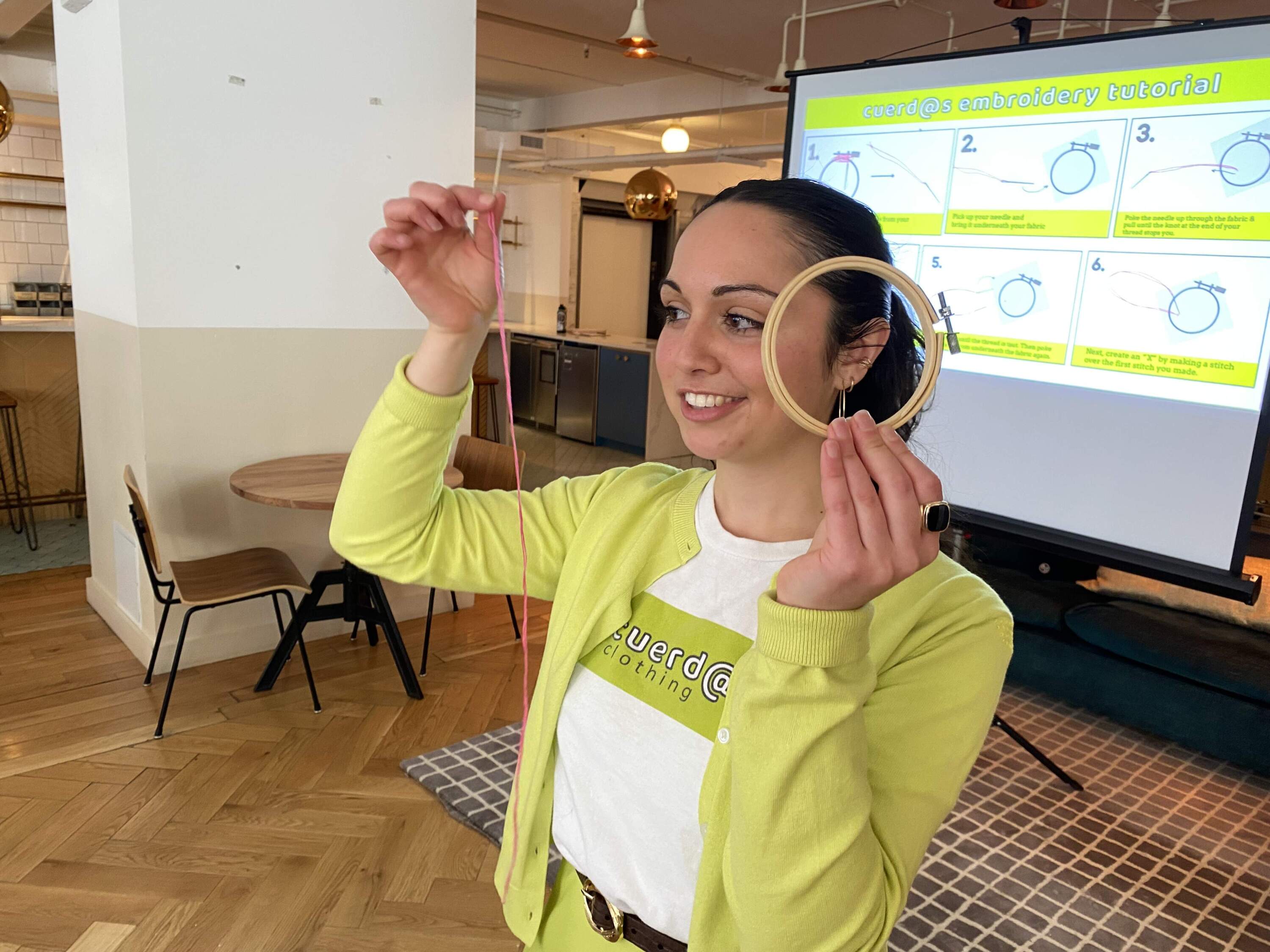 Megan Burke leads a public stitching tutorial at Boston's School of Fashion Design. (Andrea Shea/WBUR)