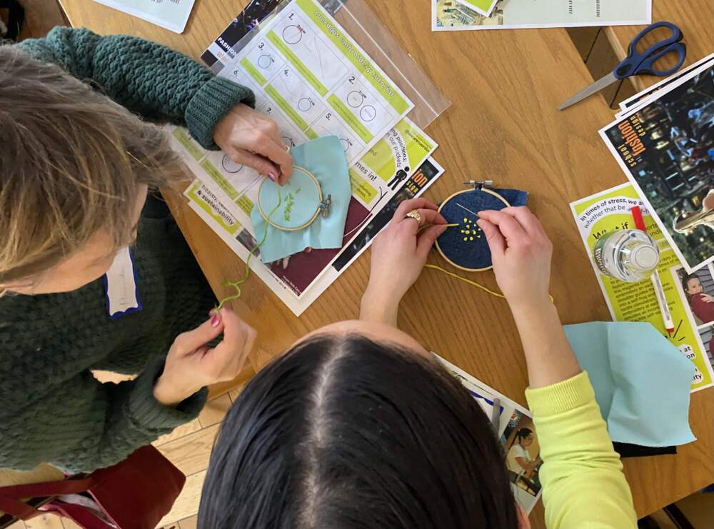 Megan Burke likes to say "every stitch is proof of connection." (Andrea Shea/WBUR)