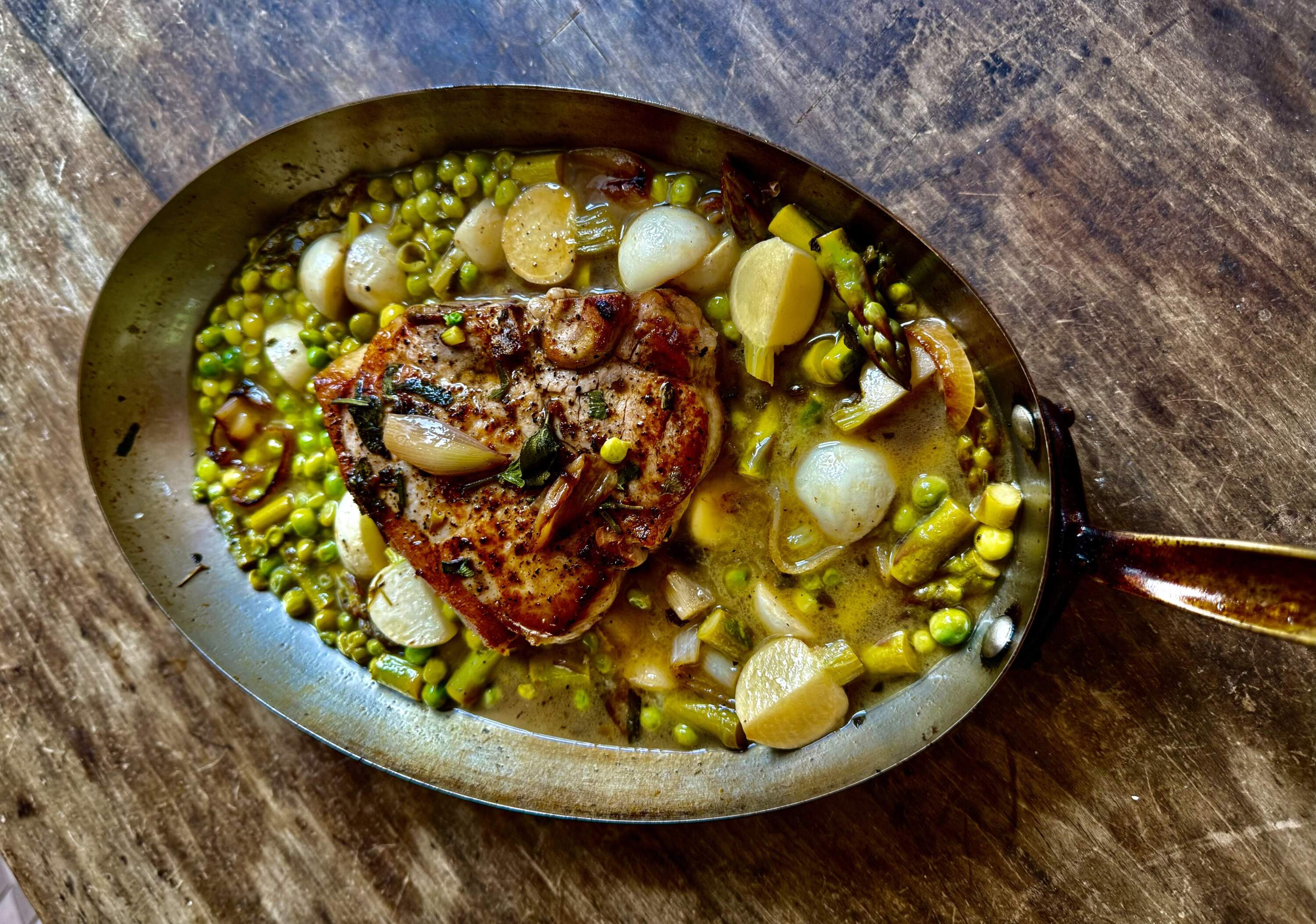 Sauteed pork chops with spring asparagus, peas and turnips. (Kathy Gunst/Here & Now)