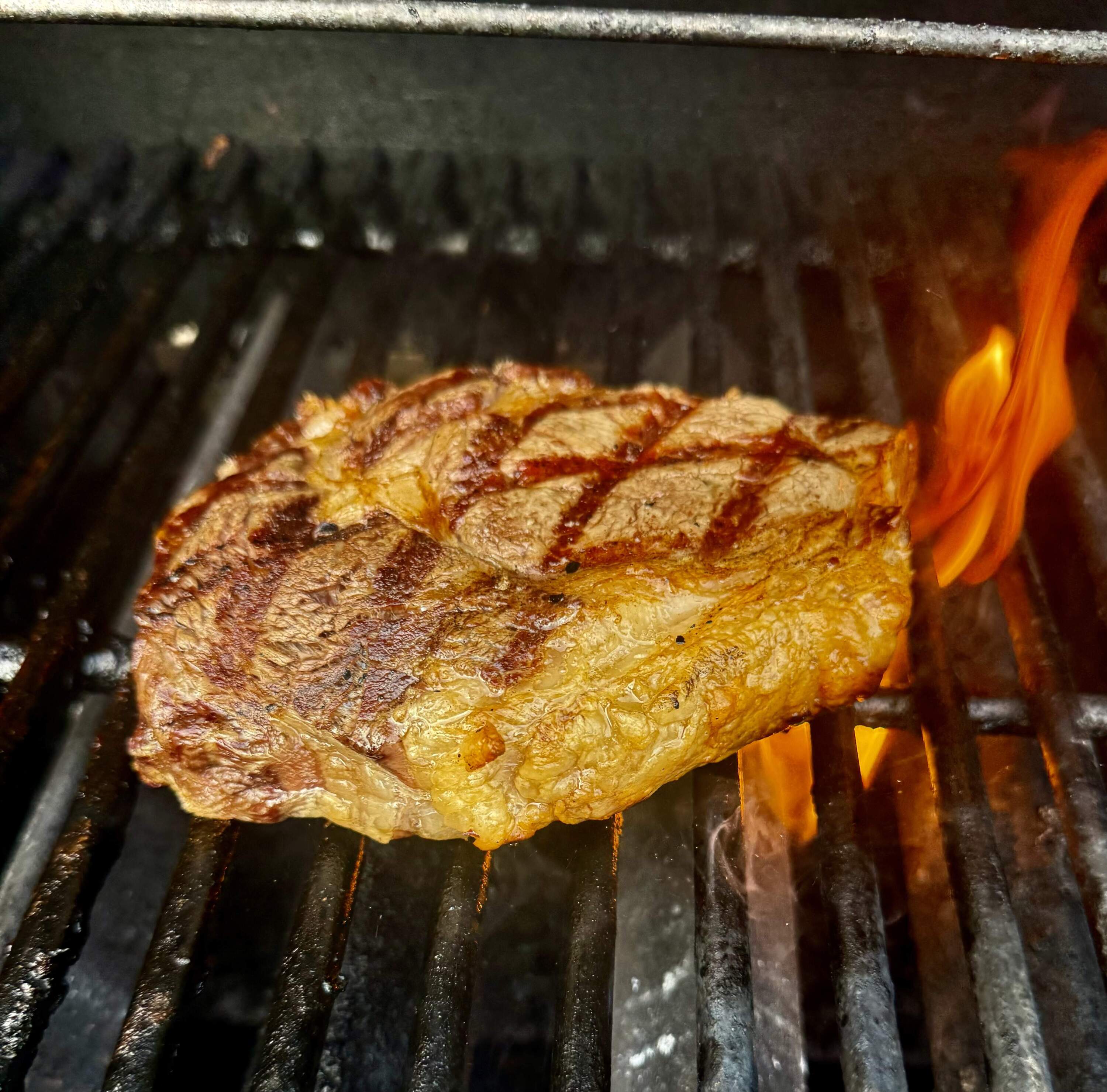 A ribeye steak on the grill. (Kathy Gunst/Here &amp; Now)