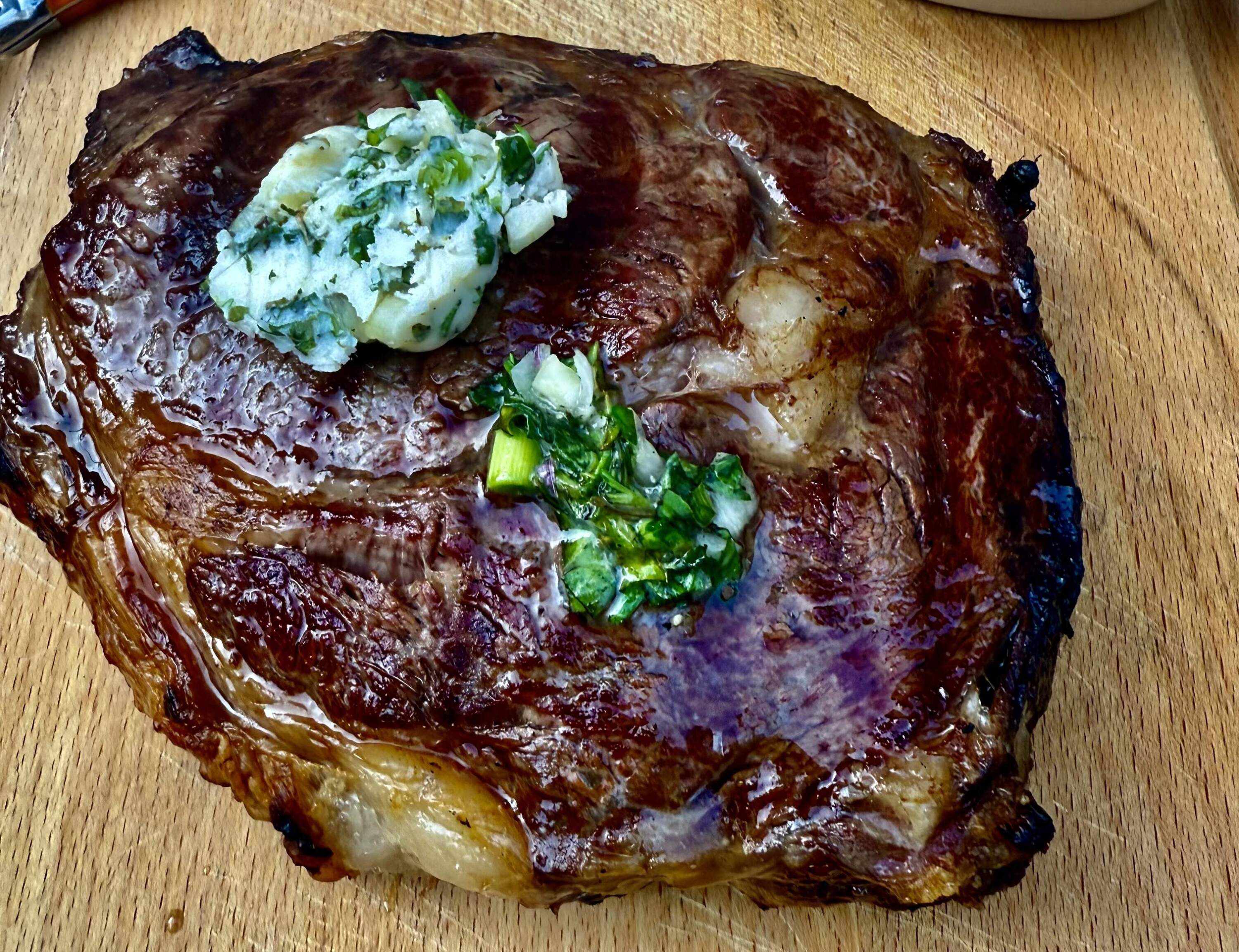 Grilled ribeye with garlic-herb butter. (Kathy Gunst/Here & Now)