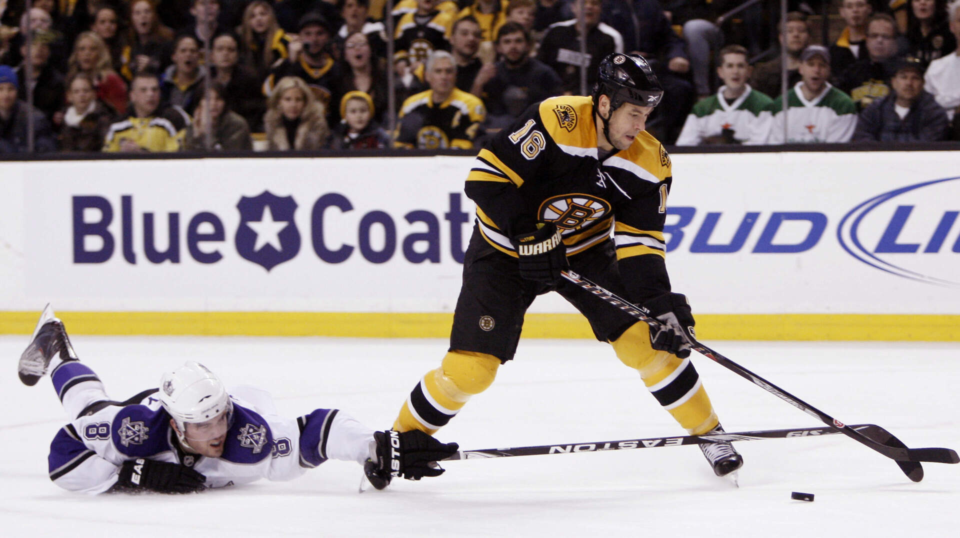 Sturm gets around the Los Angeles Kings' Drew Doughty during a 2010 game in Boston. (Winslow Townson/AP)