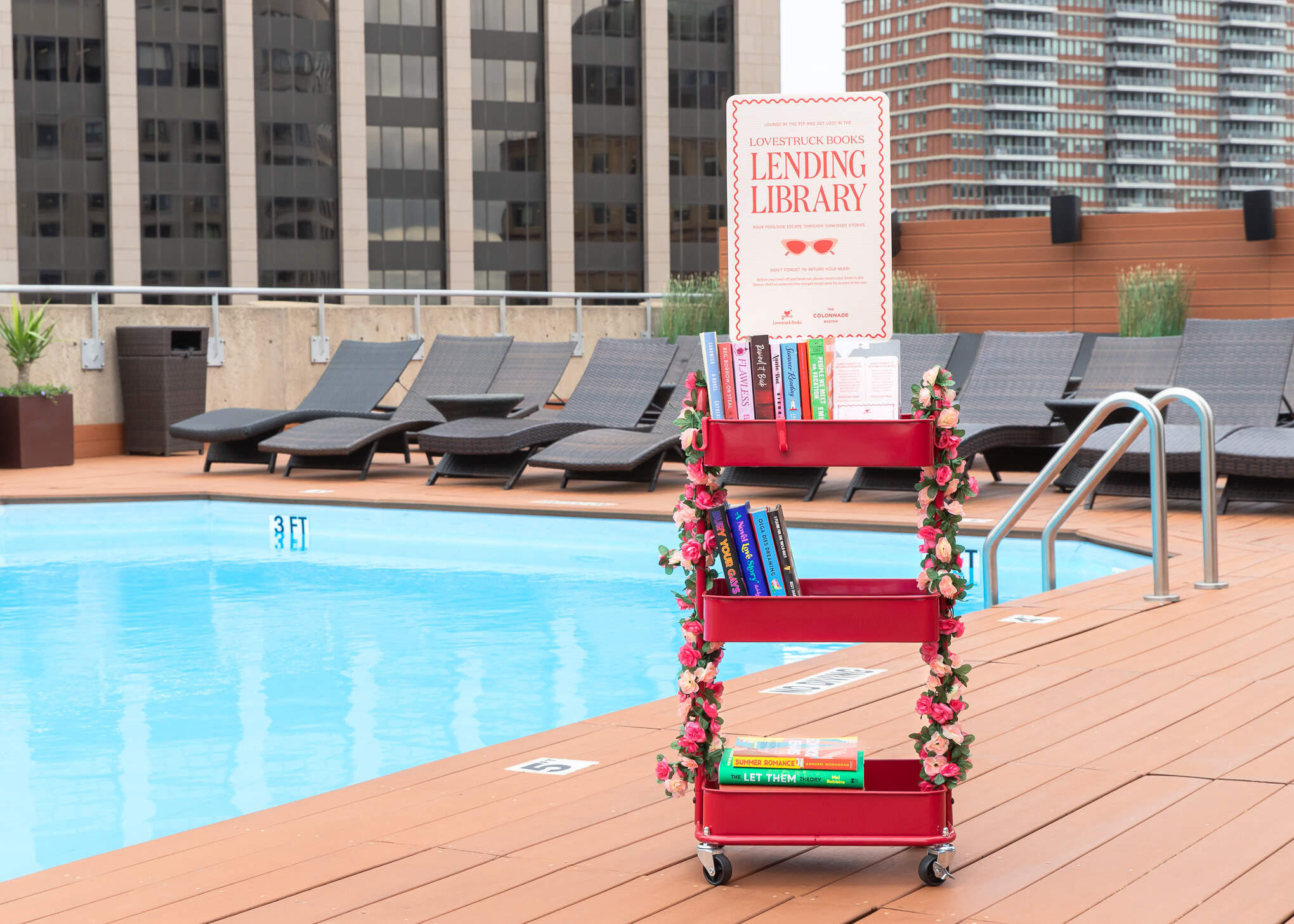 The Lovestruck Books Lending Library at The Colonnade Boston's rooftop pool. (Courtesy Reagan Byrne)