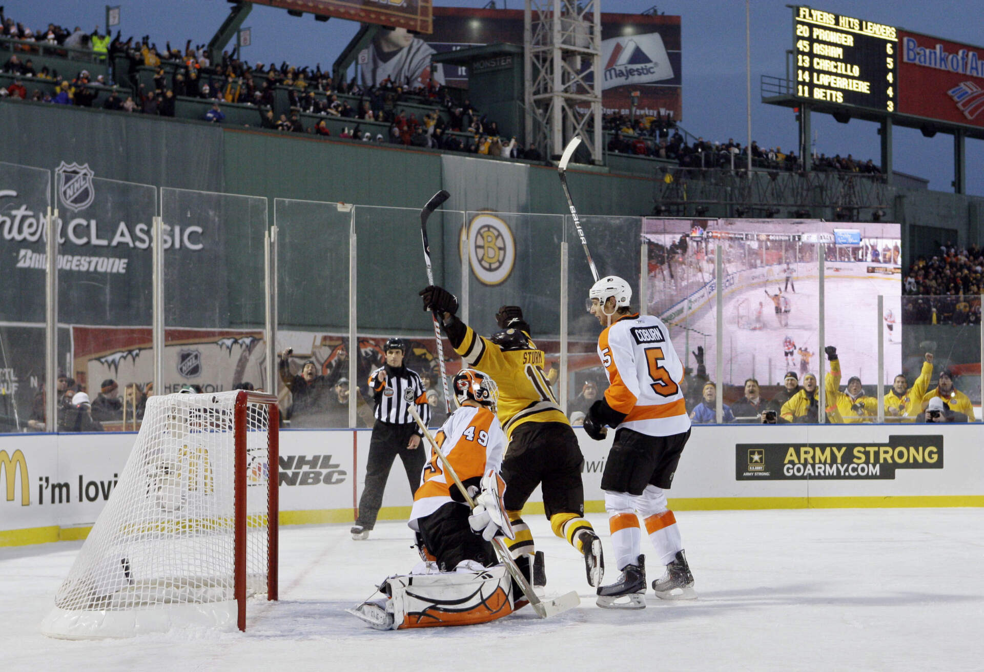 Sturm (16) celebrates after scoring the game-winning goal in overtime of the 2010 New Year's Day Winter Classic game at Fenway Park. (Elise Amendola/AP)