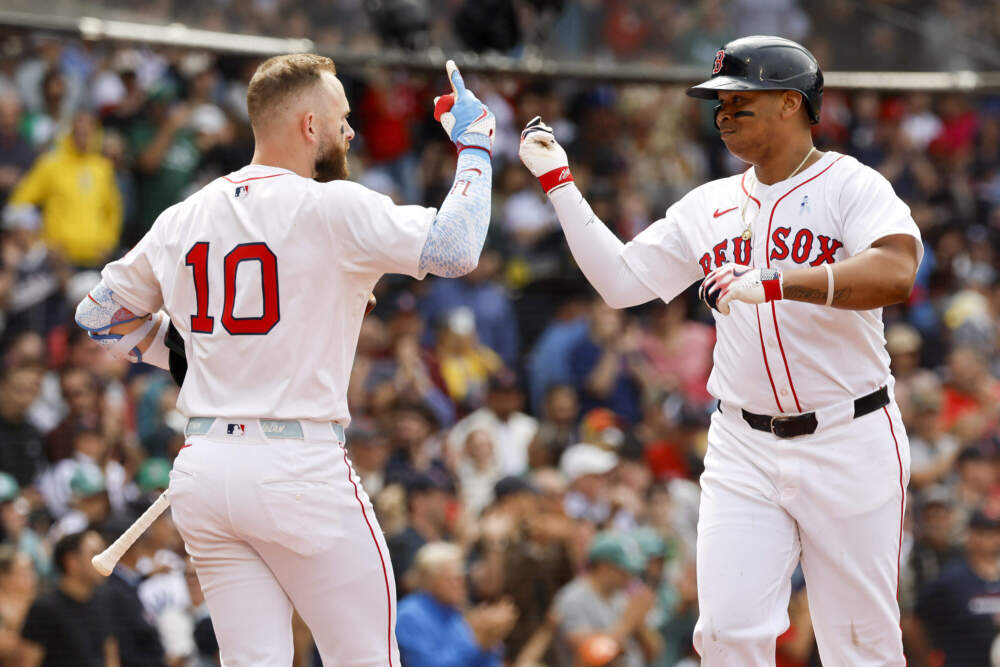Rafael Devers, right, celebrates with shortstop Trevor Story (10) after hitting a solo home run in the fifth inning of a baseball game against the New York Yankees, Sunday, June 15, 2025, in Boston. (Greg M. Cooper/AP)