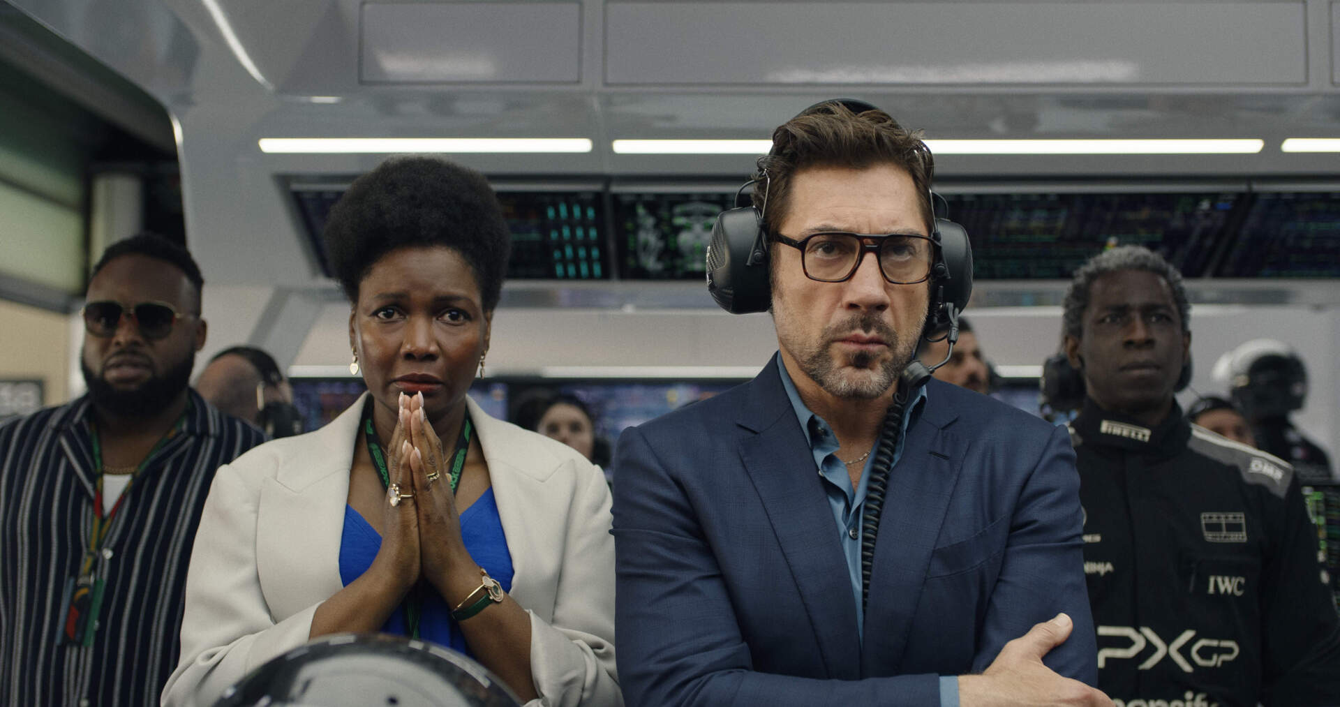 From left, Sarah Niles and Javier Bardem in director Joseph Kosinski's "F1: The Movie." (Courtesy Warner Bros. Pictures/Apple Original Films)