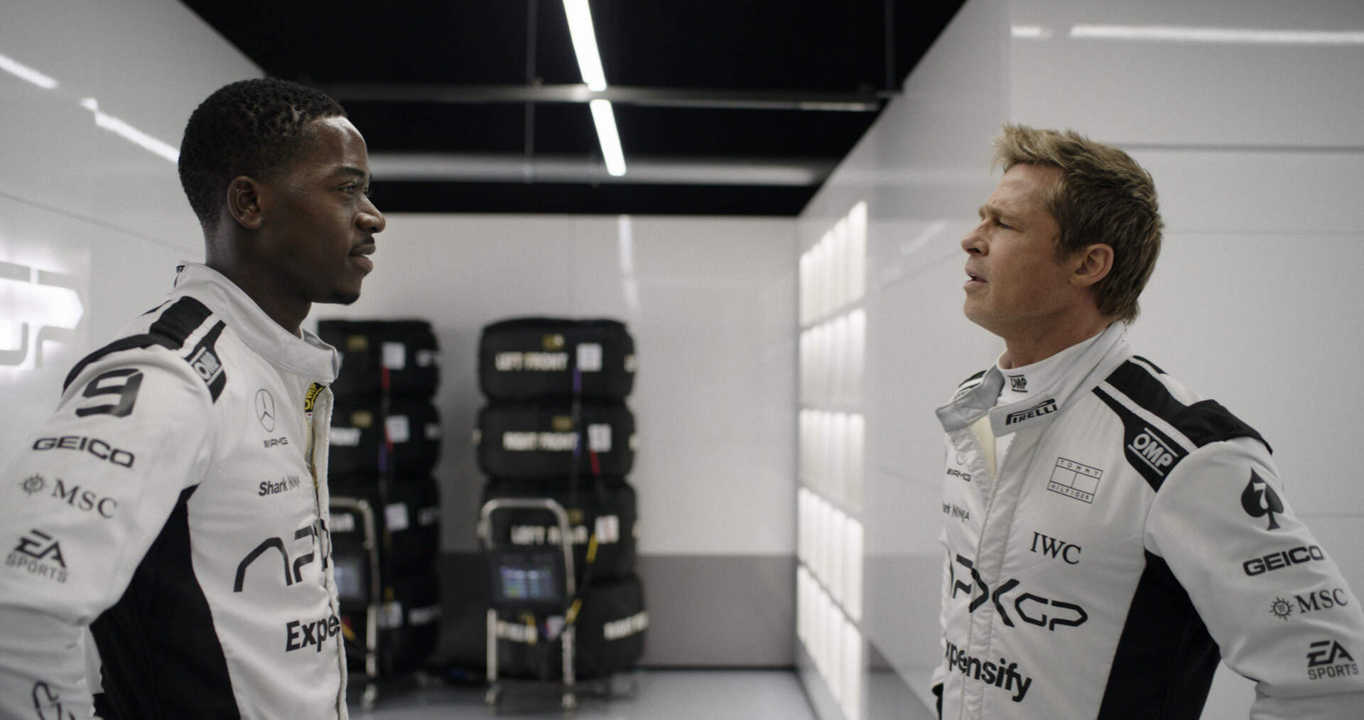Damson Idris (left) and Brad Pitt in director Joseph Kosinski's "F1: The Movie." (Courtesy Warner Bros. Pictures/Apple Original Films)