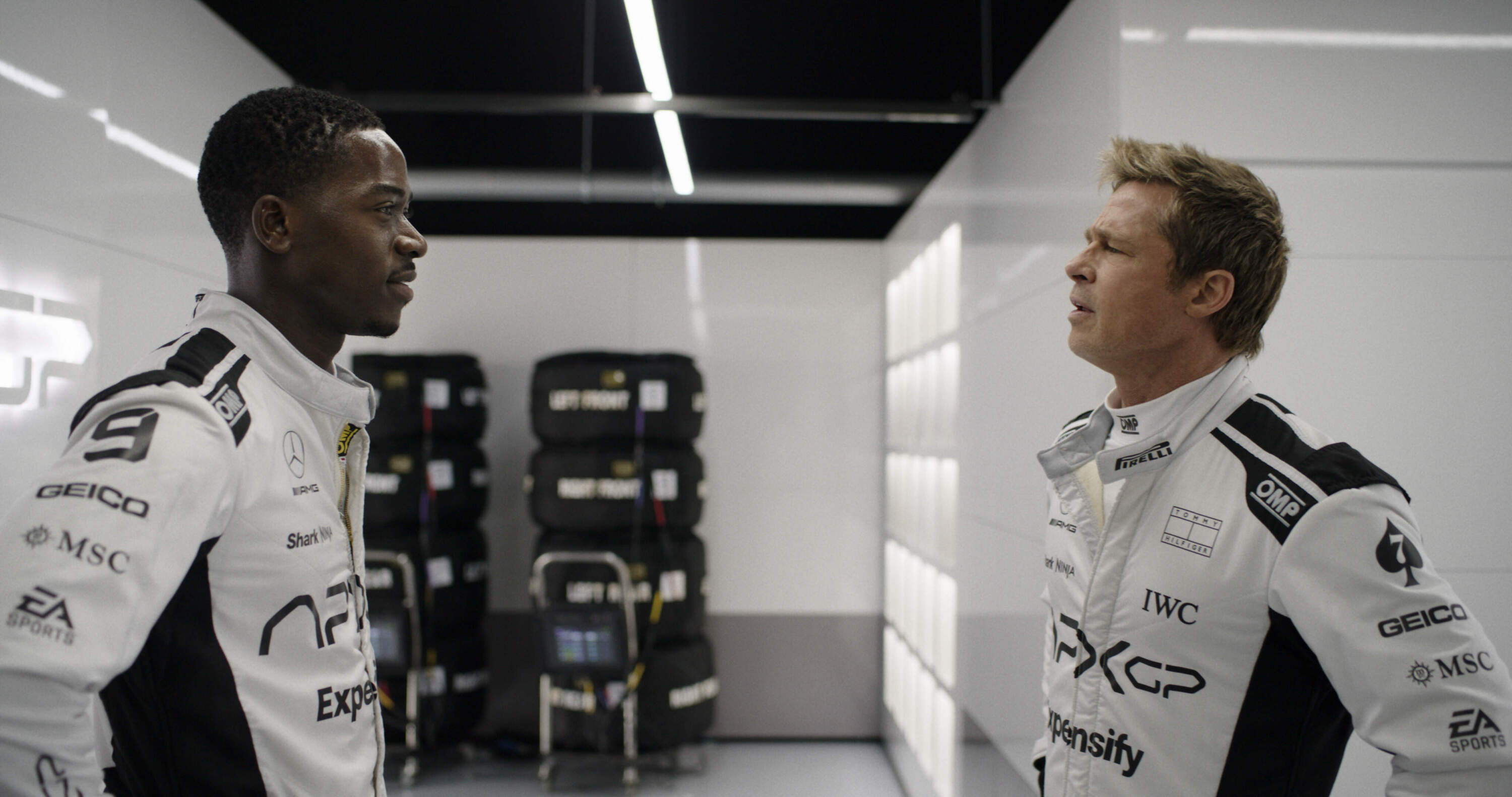 Damson Idris (left) and Brad Pitt in director Joseph Kosinski's "F1: The Movie." (Courtesy Warner Bros. Pictures/Apple Original Films)