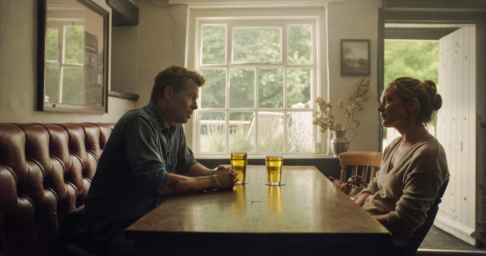 Brad Pitt and Kerry Condon in director Joseph Kosinski's "F1: The Movie." (Courtesy Warner Bros. Pictures/Apple Original Films)