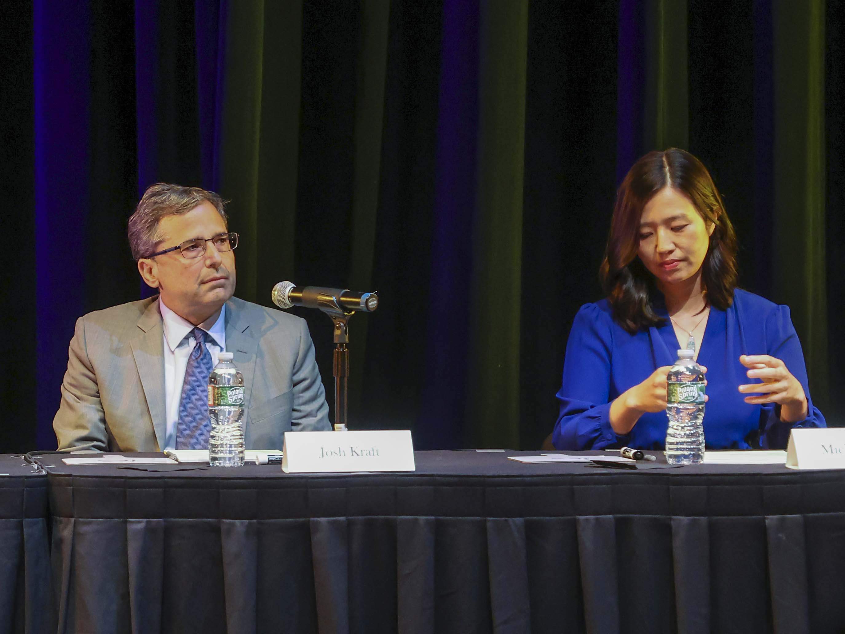 Josh Kraft and Michelle Wu at the start of the first 2025 Boston mayoral debate in May. (Matthew J. Lee/The Boston Globe)