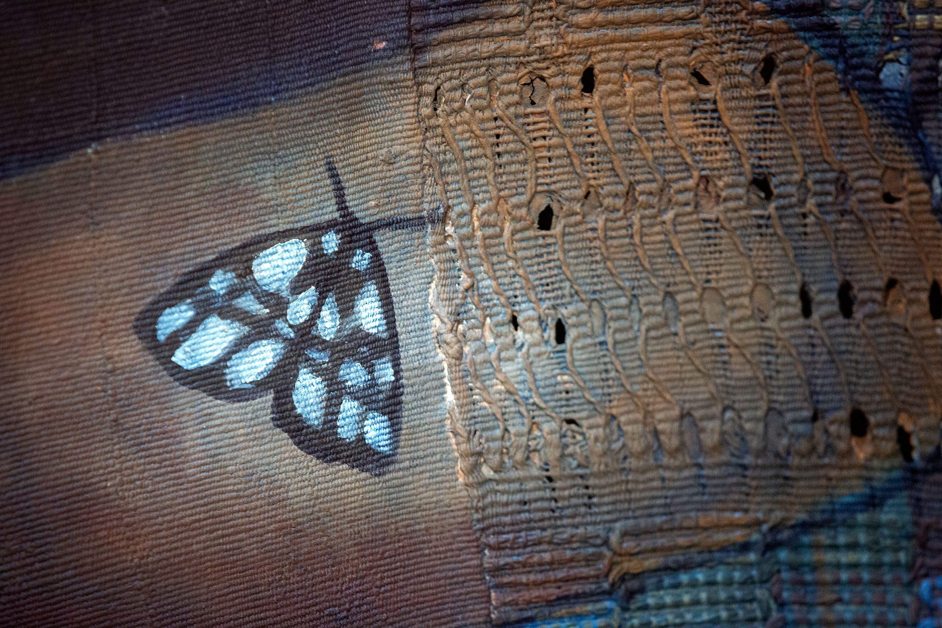 A silk moth adorns Stephen Hamilton's intricate weaving. (Robin Lubbock/WBUR)