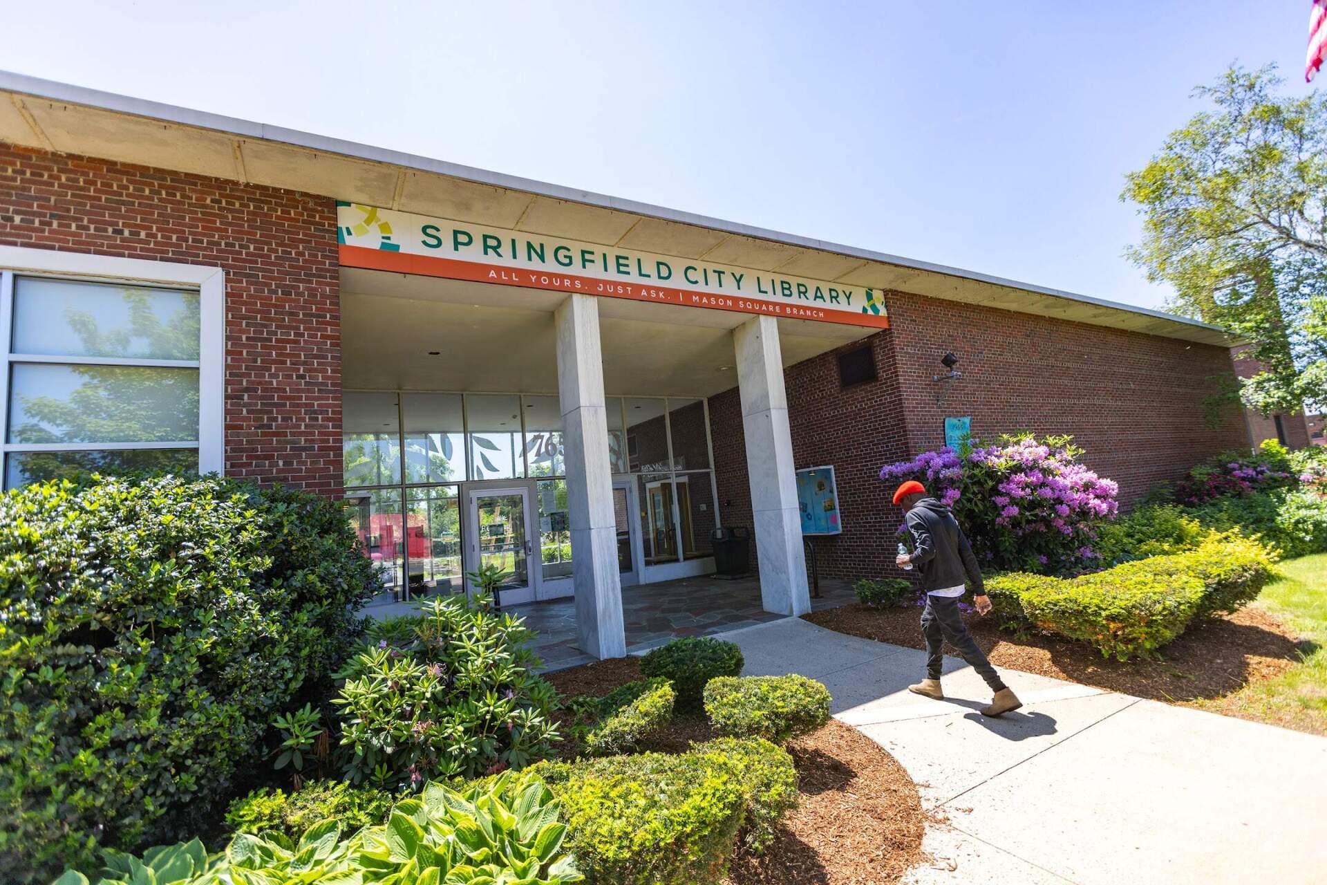 A man enters the Mason Square Branch of the Springfield City Library, which was slated to be upgraded to geothermal energy with the $20 million EPA grant. (Jesse Costa/WBUR)