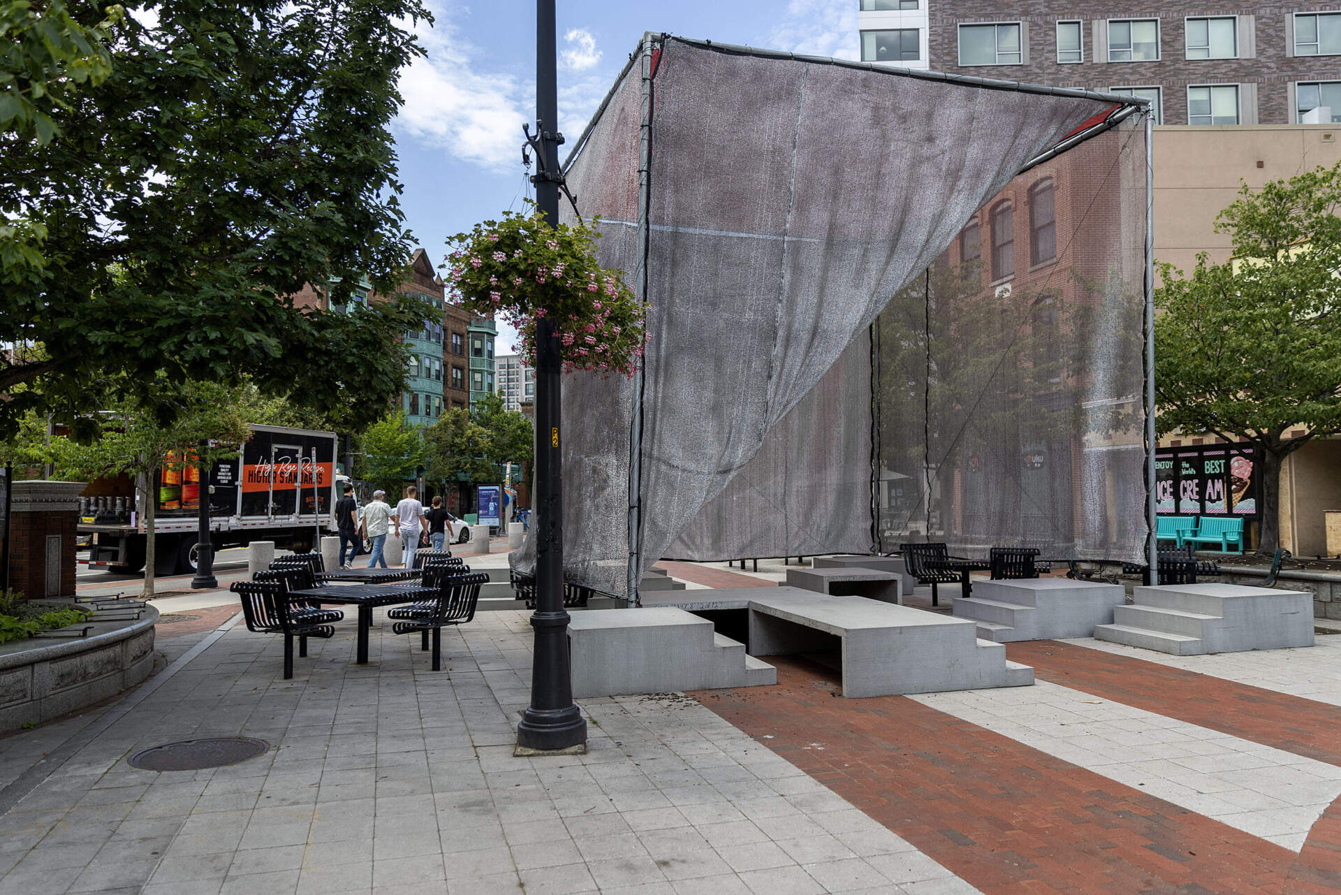 “Sun Block,” an installation at Jill Brown-Rhone Park in Cambridge, offers shade to passersby on a sunny day. (Robin Lubbock/WBUR)