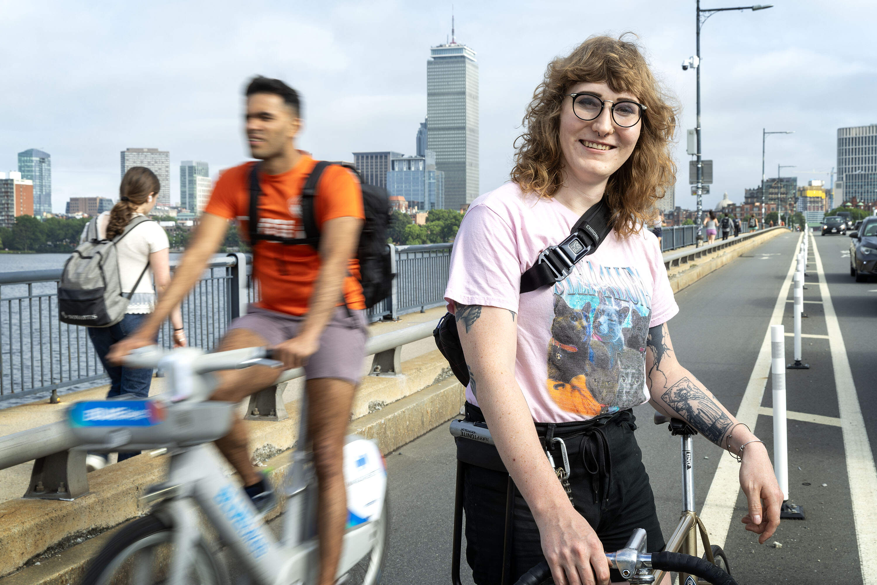 Mandy Wilkens of the Boston Cyclists Union on Massachusetts Ave. bridge across the Charles River. (Robin Lubbock/WBUR)