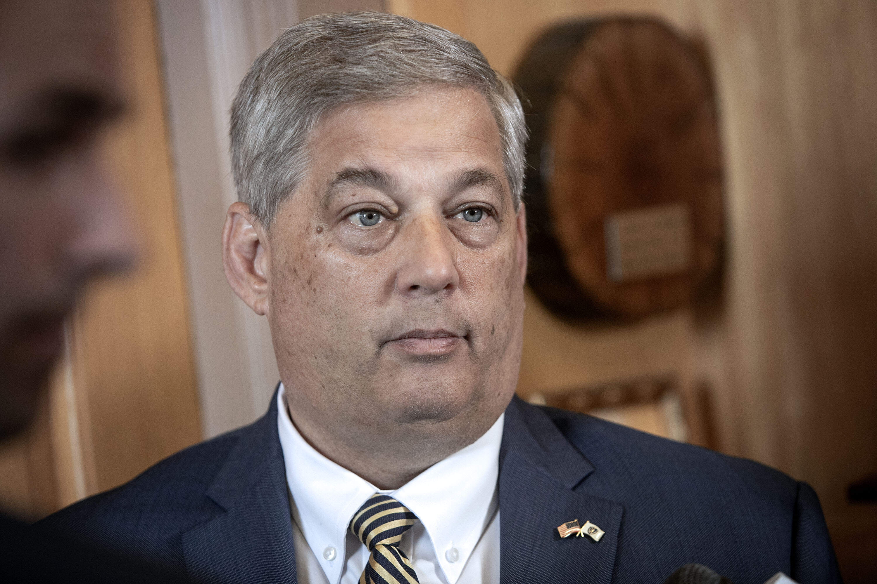State Senate Republican leader Bruce Tarr takes a question from a reporter, in his office at the Mass. State House on Wednesday. (Robin Lubbock/WBUR)