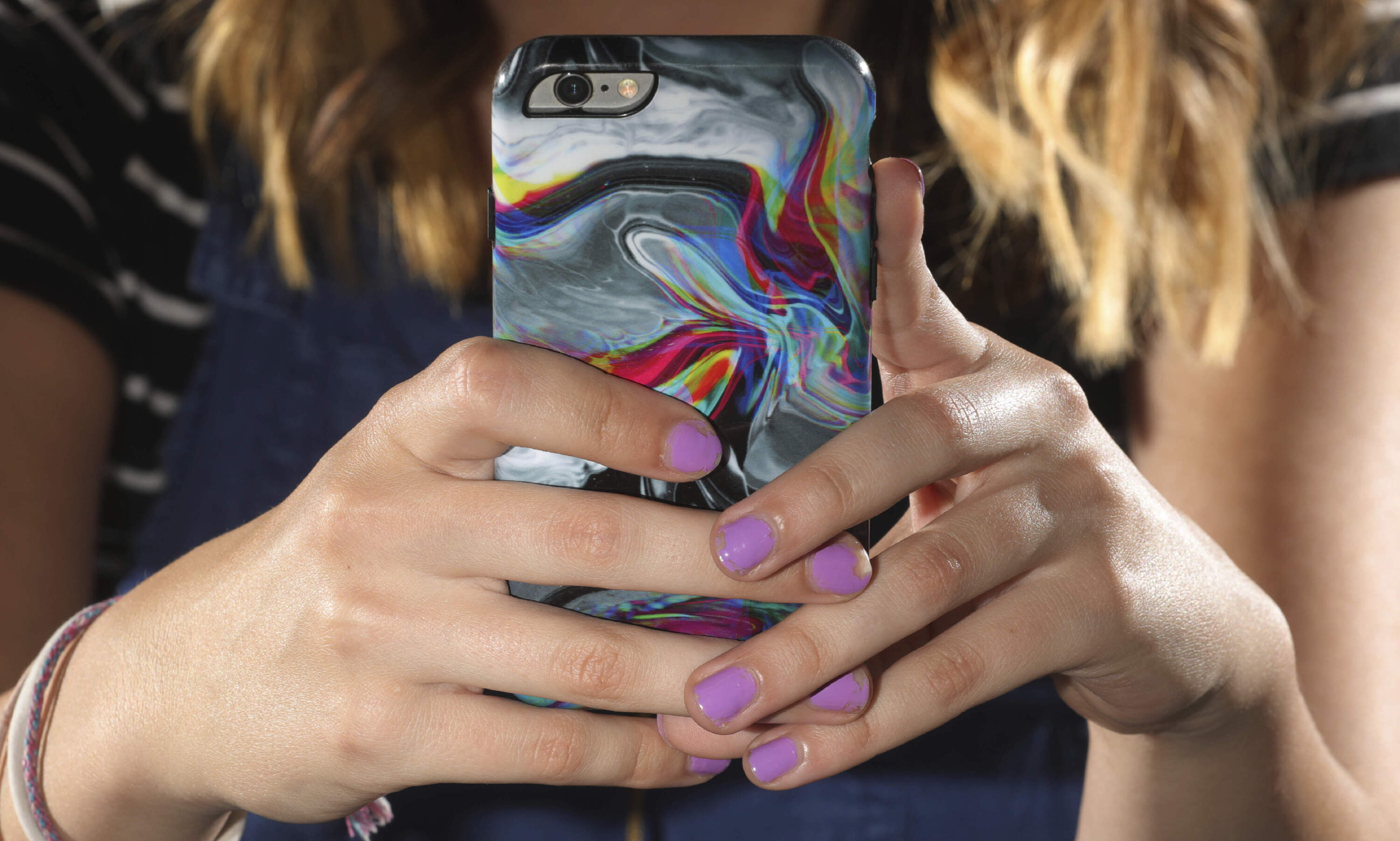 There's a rise in cyberbullying nationwide, with more women reporting being harassed online or by text message than men, according to the National Center for Education Statistics. (Rick Bowmer/AP)