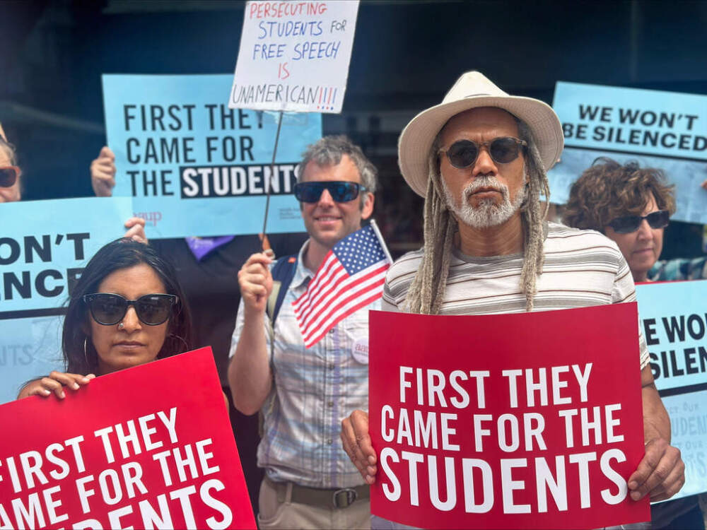 People show their support for a lawsuit challenging the Trump administration's policy of targeting students for deportation who took part in pro-Palestinian demonstrations. (Michael Casey/AP)