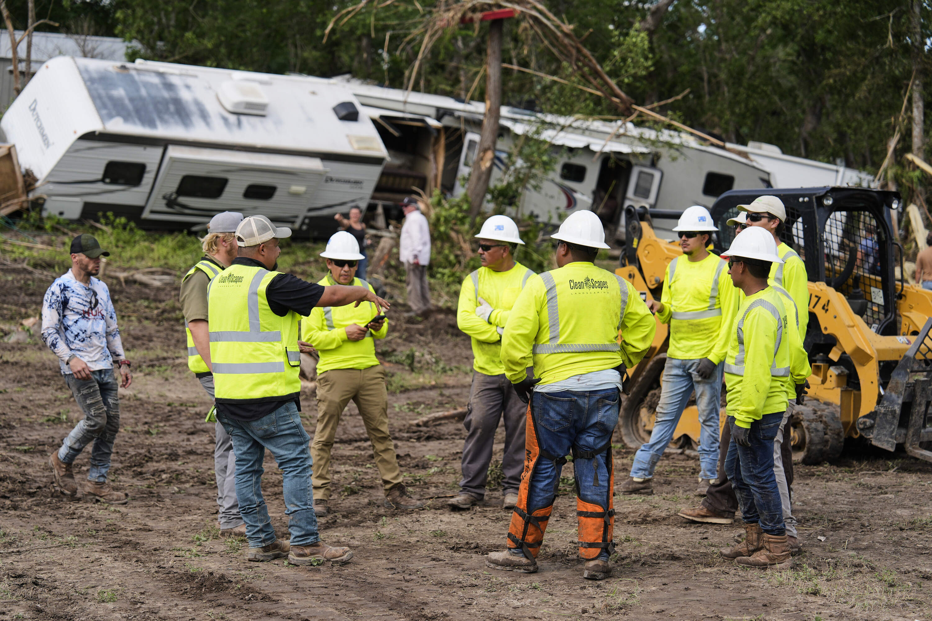 People help during clean-up efforts at Guadalupe Keys Resort, an RV park in Center Point, Texas, after flooding, Monday, July 7, 2025. (Ashley Landis/AP)