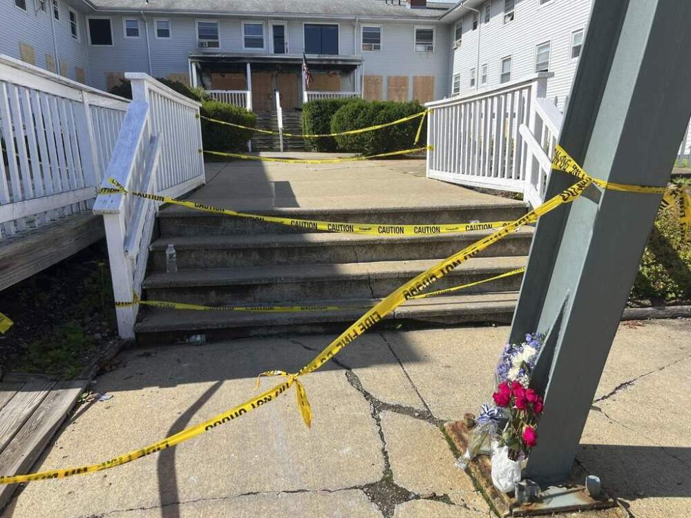Flowers sit in front of the Gabriel House in Fall River on Tuesday. (Kimberlee Kruesi/AP)
