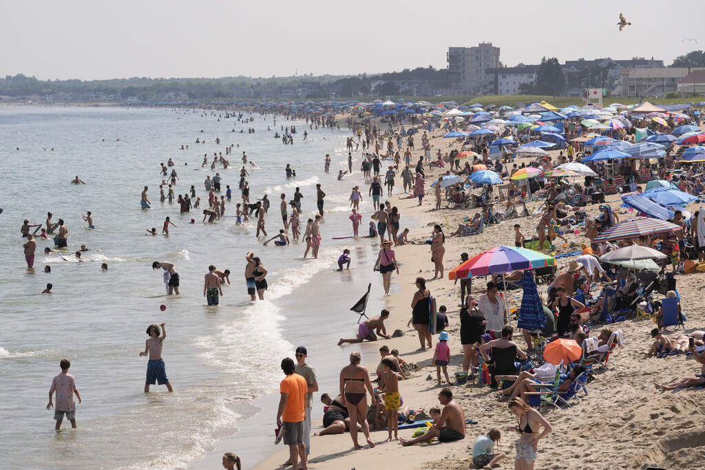 A crowd seeks relief from the heat Tuesday, July 29, 2025, at Old Orchard Beach, Maine. (Robert F. Bukaty/AP)