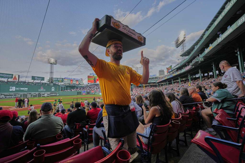 A vendor sells lemonade at Fenway Park in June.