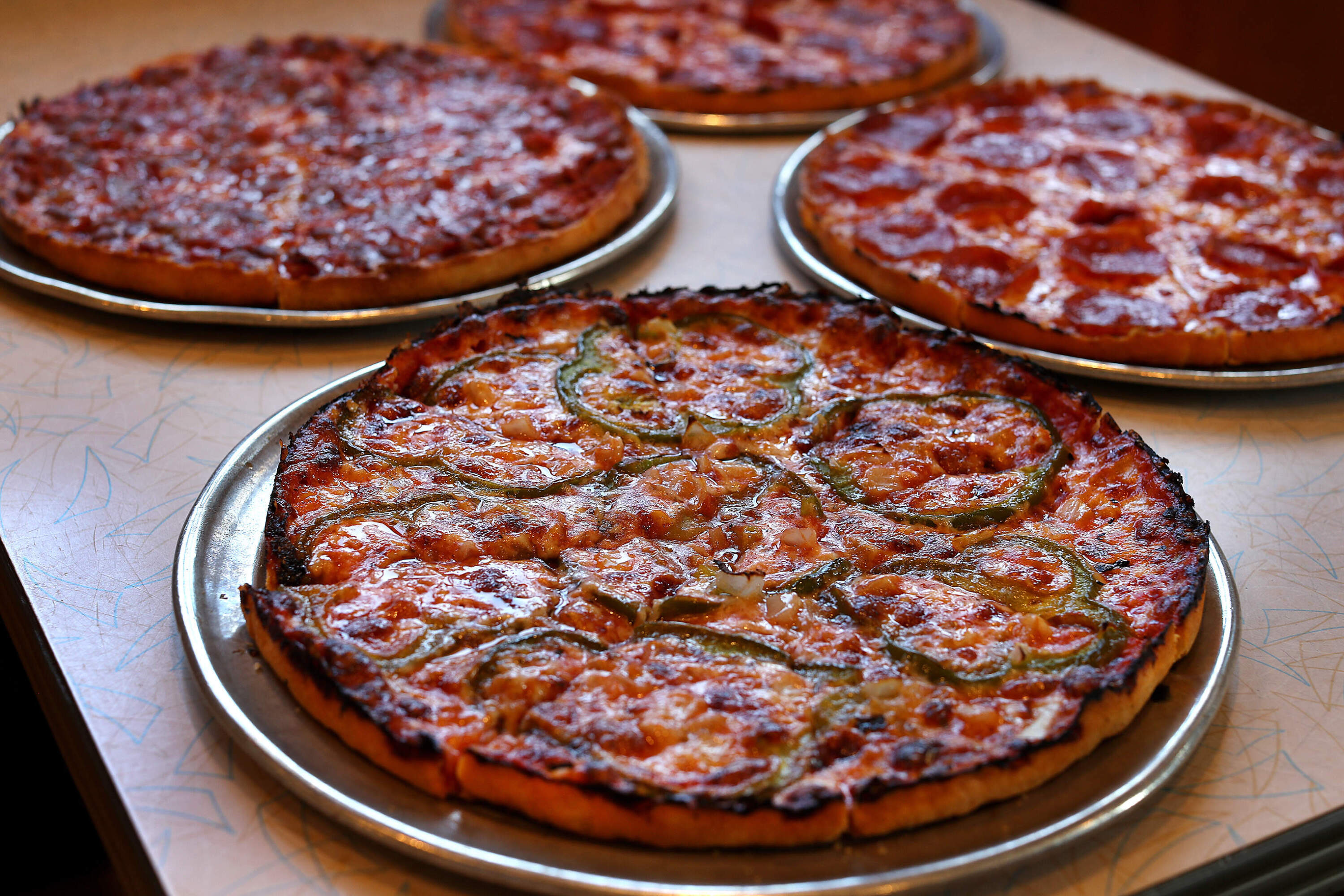 A laced pepper and onion bar pizza at The Lynwood Cafe in Randolph. (John Tlumacki/The Boston Globe via Getty Images)
