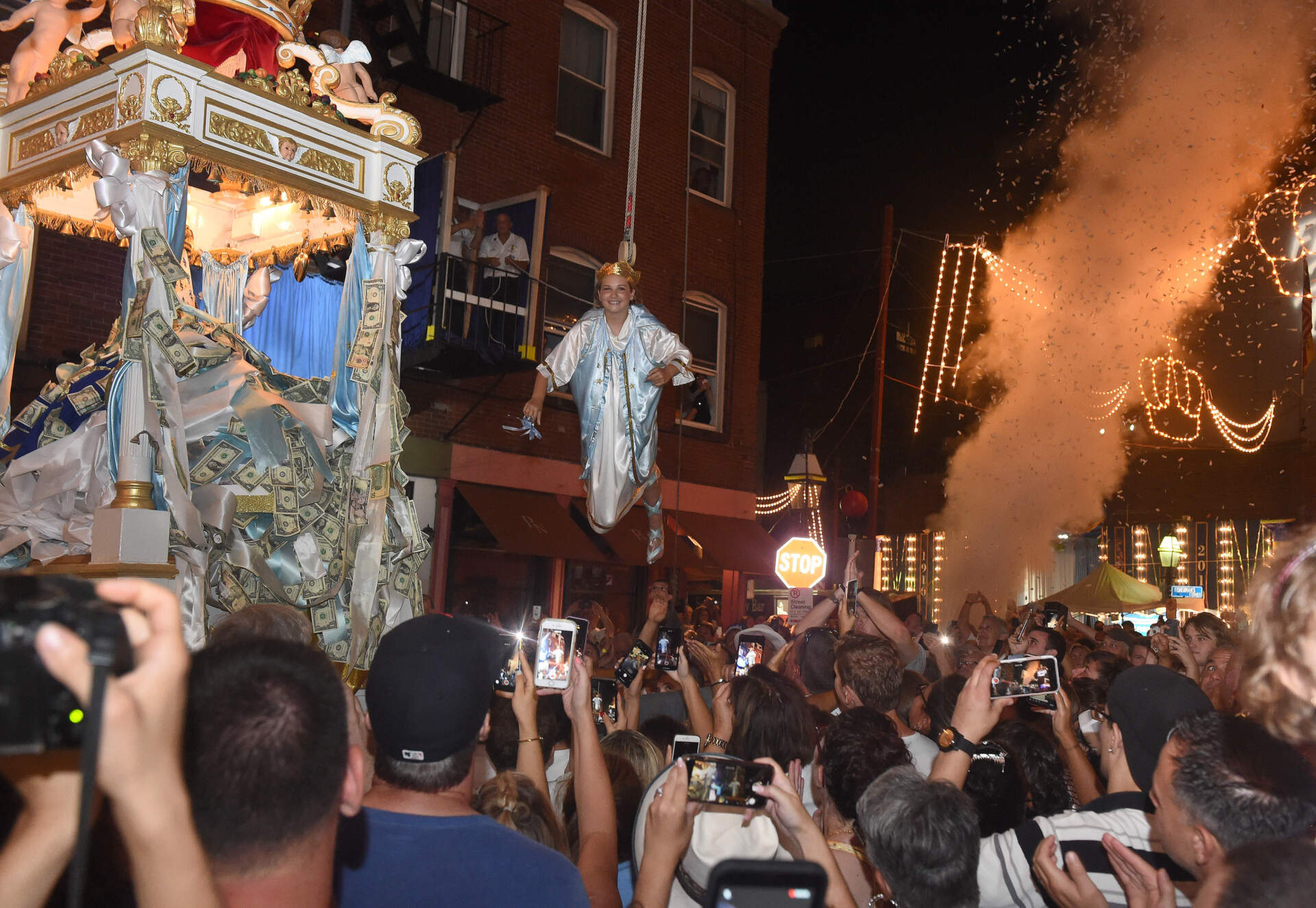 Victoria Carregal soars above the crowd during the 2019 Fisherman's Feast festival in Boston's North End. (Jim Michaud/MediaNews Group/Boston Herald via Getty Images)