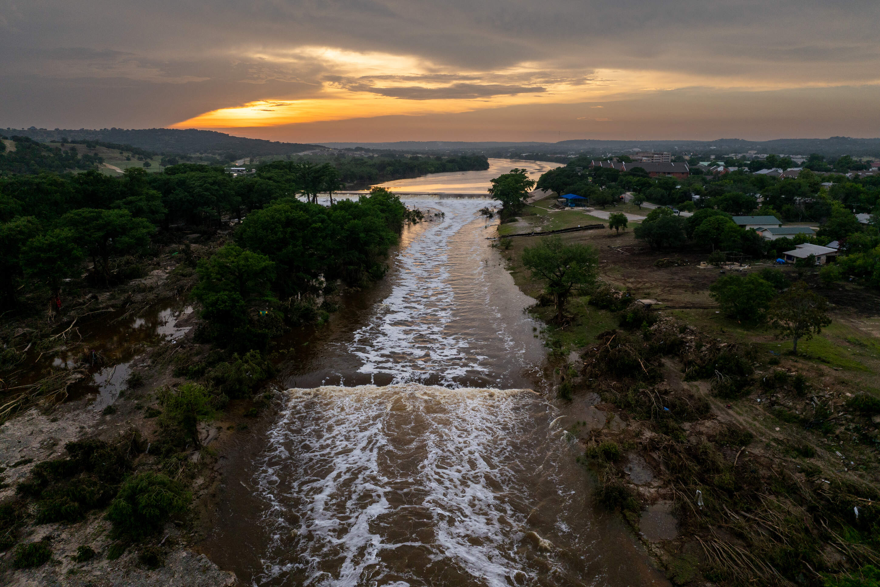 In an aerial view, the sun sets over the Guadalupe River on July 06, 2025 in Kerrville, Texas. (Brandon Bell/Getty Images)