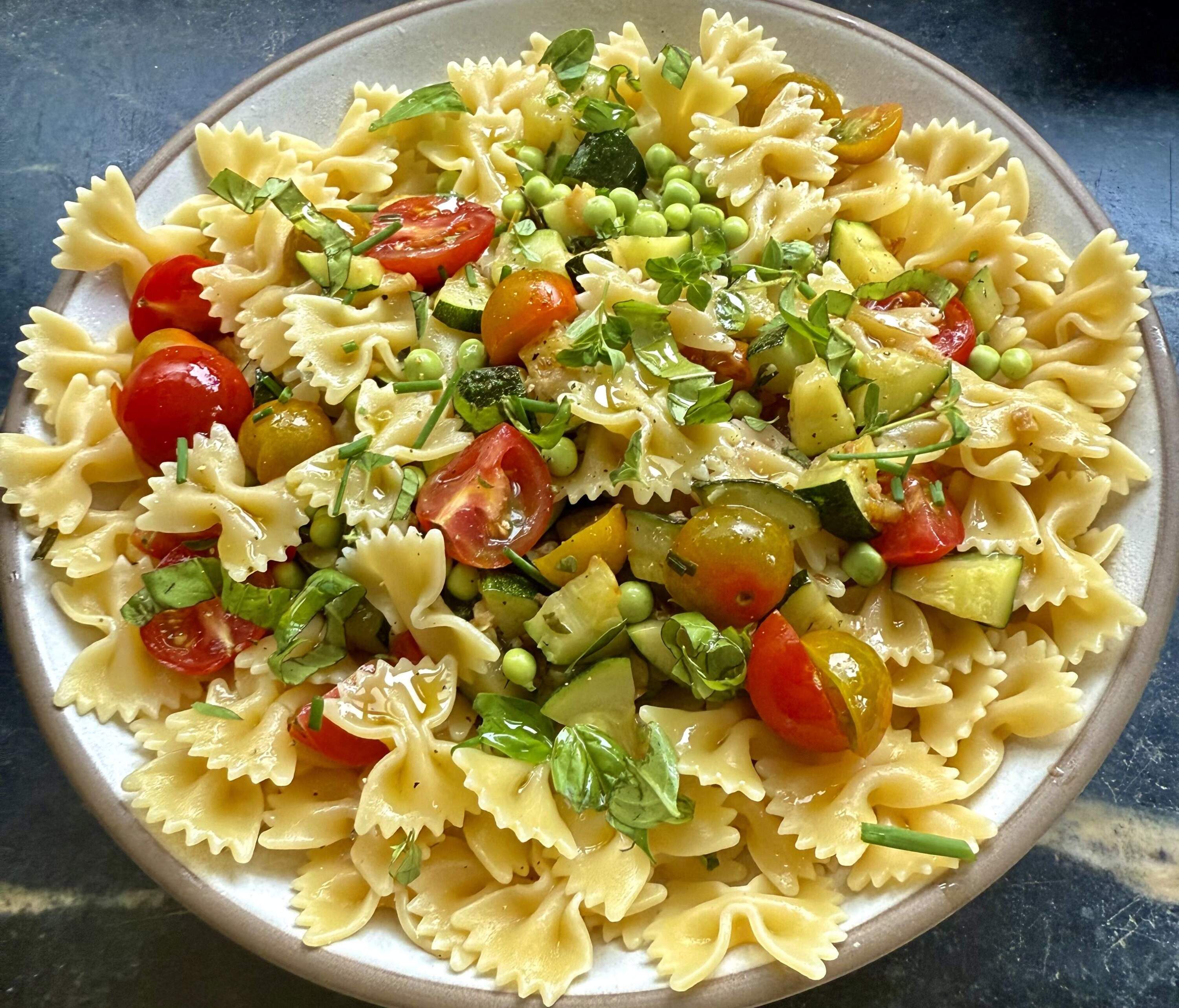Summer pasta with zucchini, garlic, peas and tomatoes. (Kathy Gunst/Here &amp; Now)