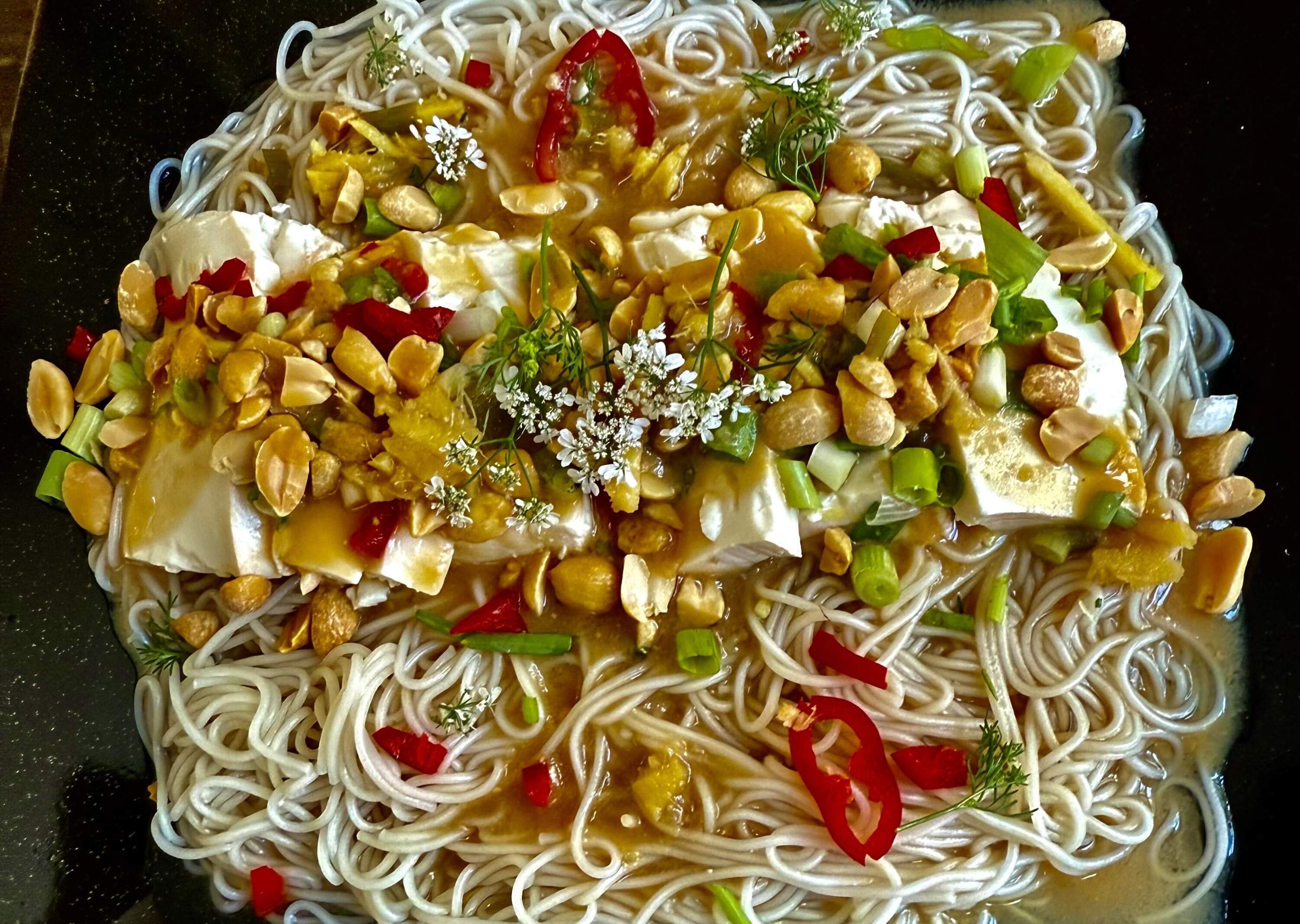 Japanese cold noodles with miso sauce, tofu, ginger and peanuts. (Kathy Gunst/Here &amp; Now)