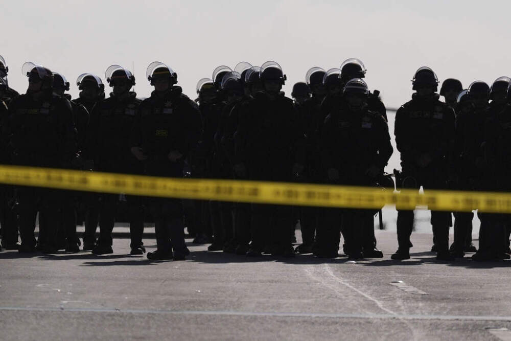 Law enforcement officers block a road during a protest on Wednesday, June 11, 2025, in Paramount, Calif. (AP Photo/Jae C. Hong)