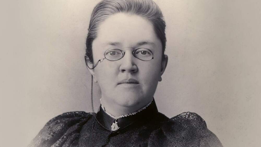 A black-and-white headshot of Katharine Lee Bates.