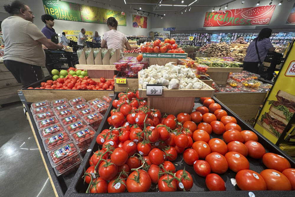 Tomatoes are displayed as customers shop at a grocery store in Illinois.