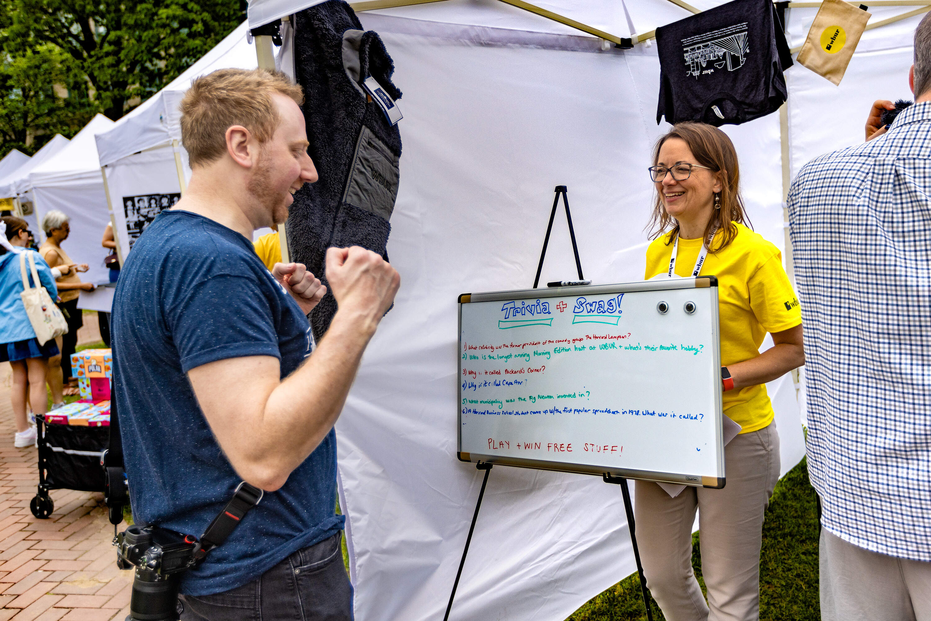 WBUR’s Lynn Jolicoeur at the trivia tent at the WBUR Festival’s Street Fair. (Jesse Costa/WBUR)