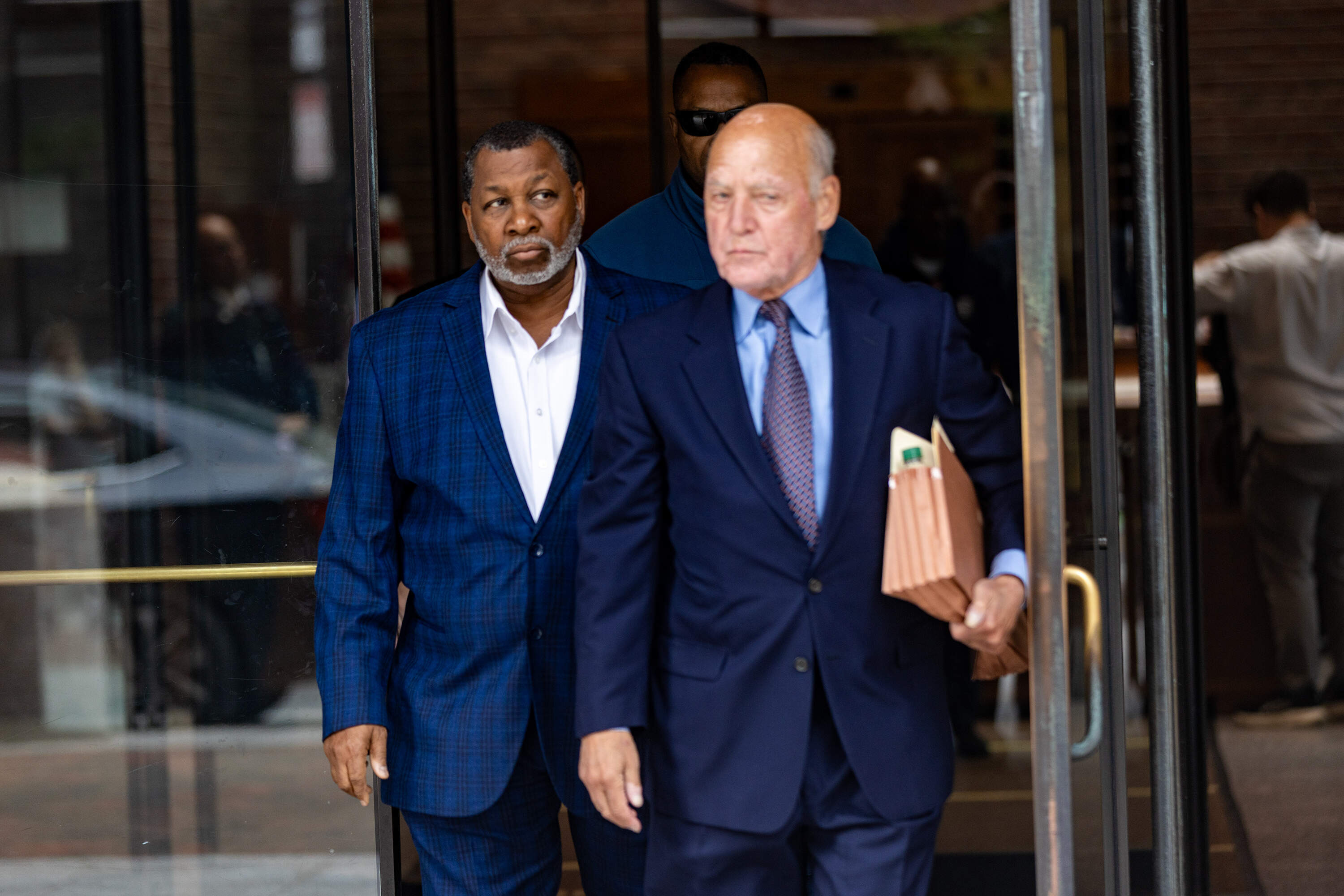 Suffolk County Sheriff Steven Tompkins leaves the Boston federal courthouse last week with his defense attorney Martin Weinberg. (Jesse Costa/WBUR)