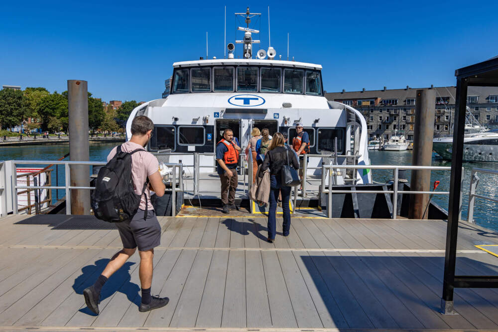 Commuters board the MBTA ferry at Long Wharf North. (Jesse Costa/WBUR)