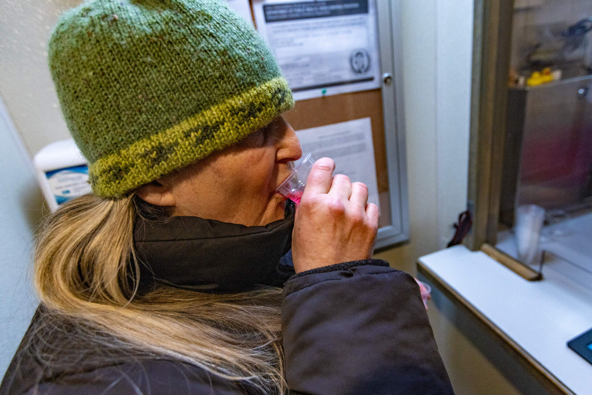 Trina takes a dose of methadone inside the the mobile addiction treatment van run by Spectrum Health Systems in Worcester. (Jesse Costa/WBUR)