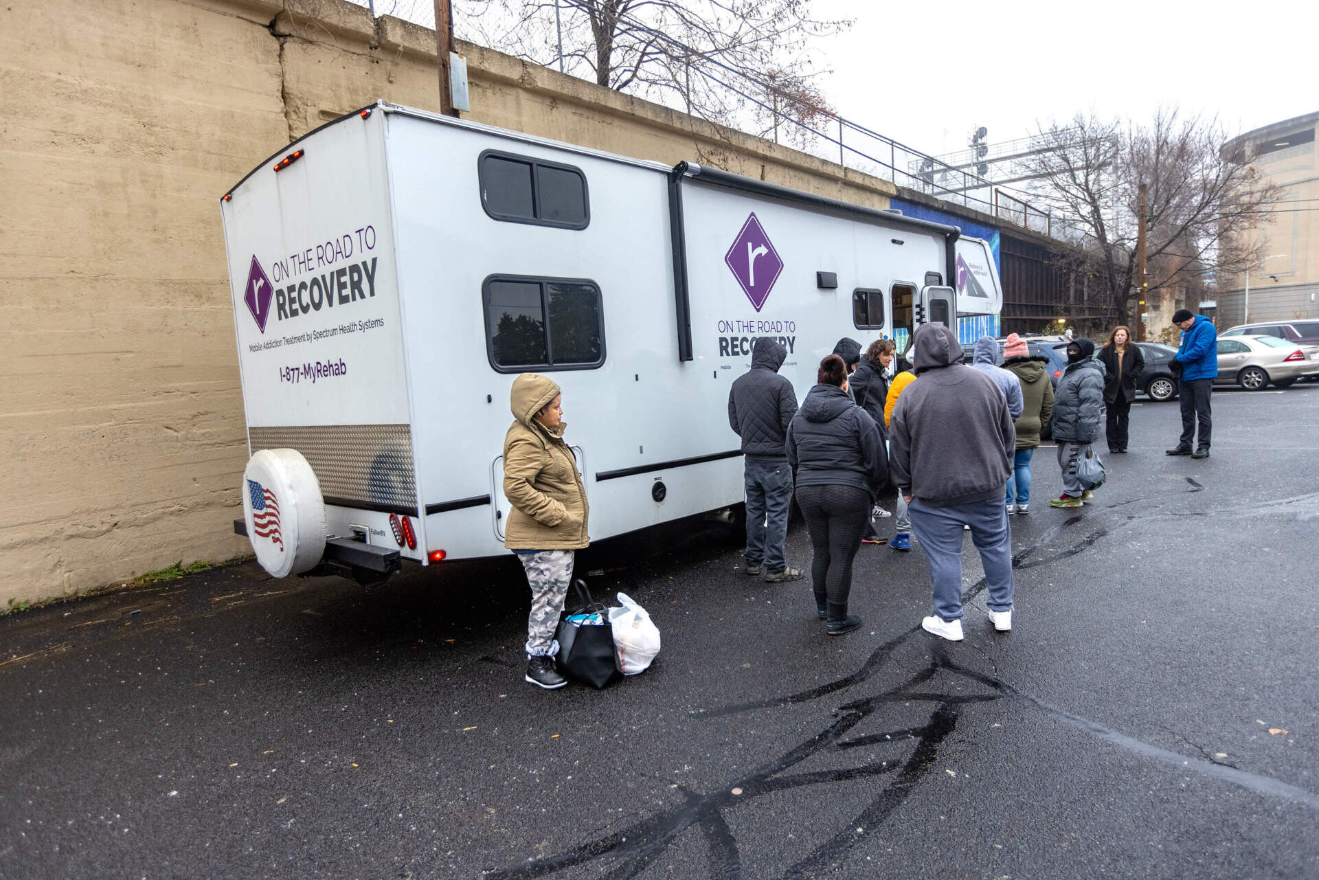 Addiction treatment patients wait in line to enter Worcester's mobile methadone van. (Jesse Costa/WBUR)